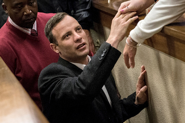 Oscar Pistorius leaves the court after his sentence hearing at the North Gauteng High Court in Pretoria, South Africa, July 6, 2016. (Reuters/Marco Longari)