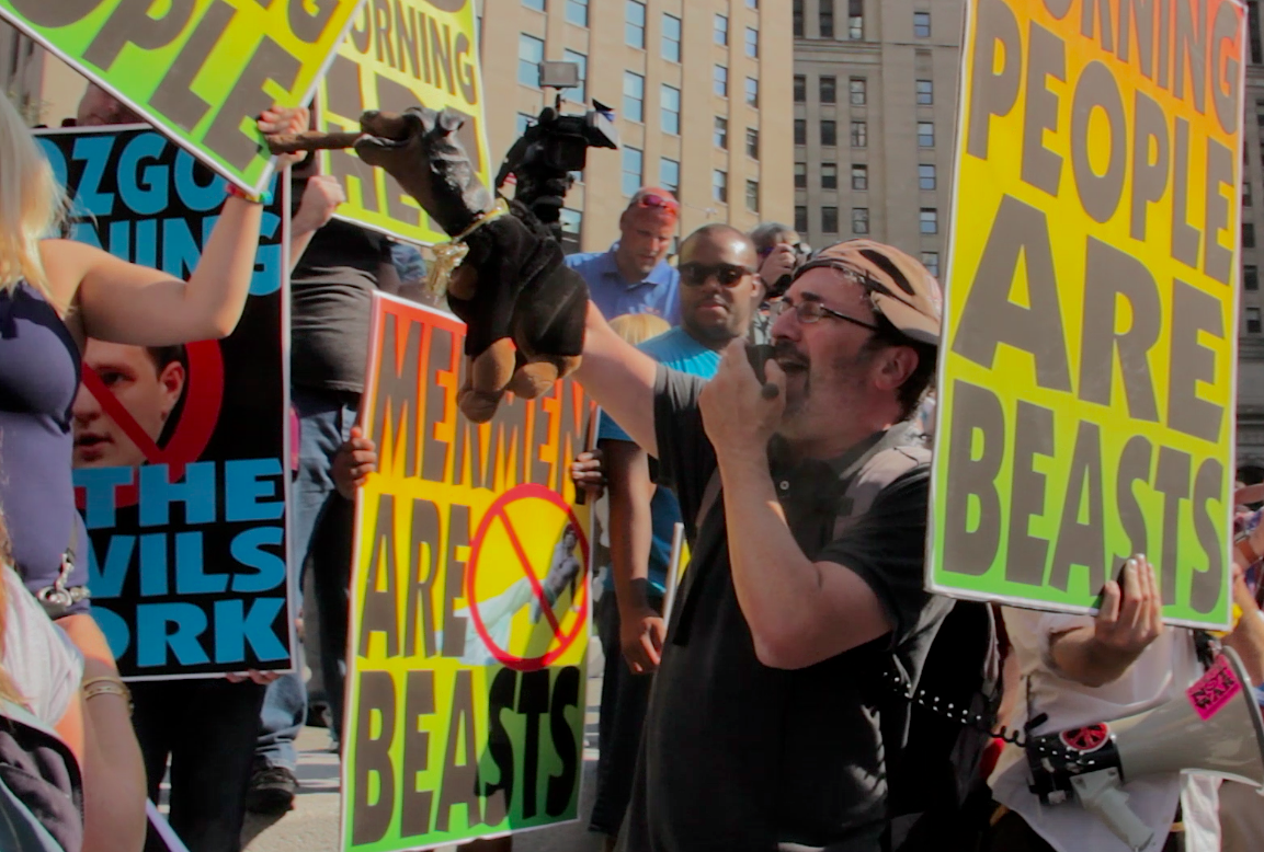 Triumph the Insult Comic Dog actor Robert Smigel trolling the Westboro Baptist Church outside the RNC on Tuesday, July 19 (Salon/Ben Norton)