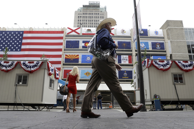 Delegates walk outside of Quicken Loans Arena before the opening session of the Republican National Convention in Cleveland, July 18, 2016. (AP/Matt Rourke)