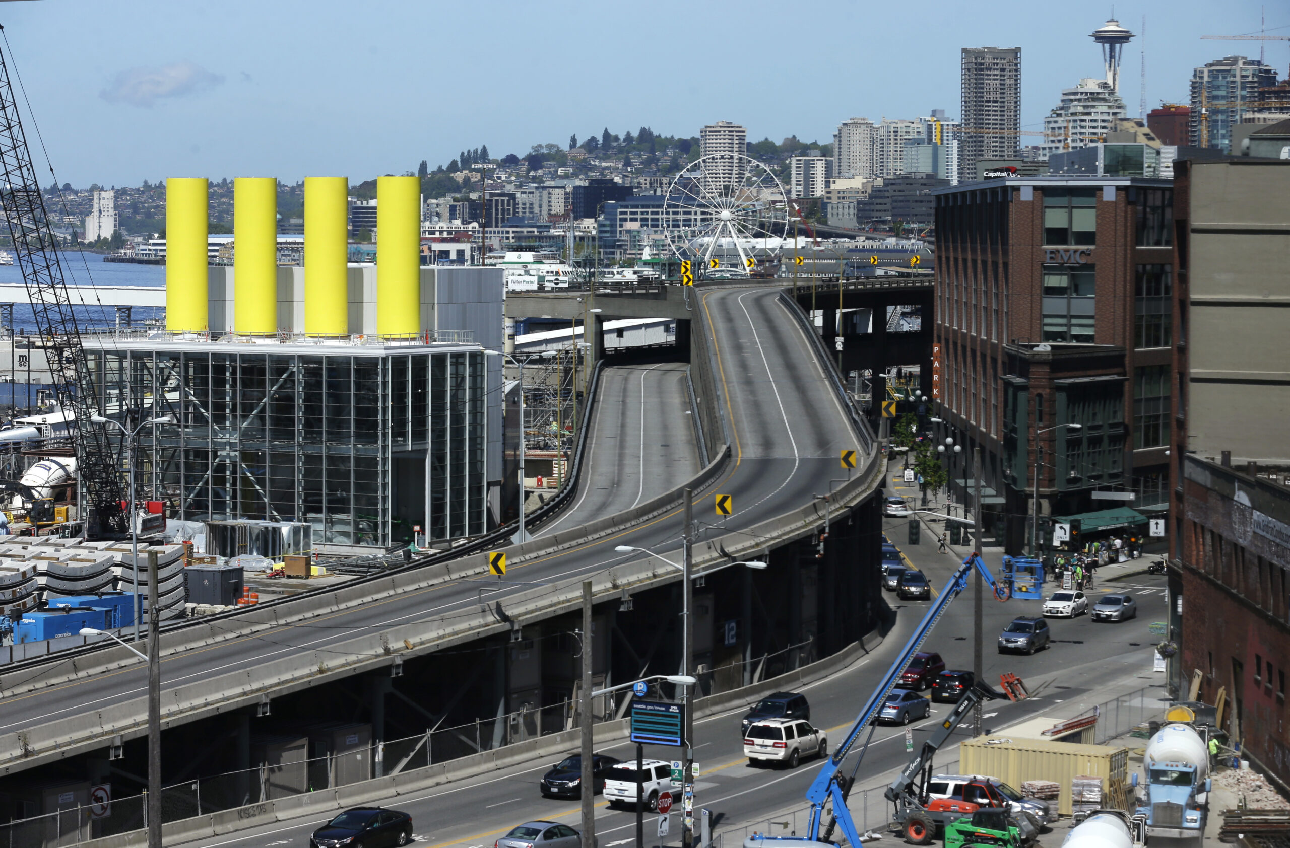 FILE - In this photo taken April 30, 2016, the southern ramps to the Alaskan Way Viaduct in Seattle are shown free of vehicles during a construction closure in Seattle. The troubled project to replace the elevated roadway with a tunnel is $223 million over budget, the Washington state Department of Transportation said Thursday, July 21, 2016. The original completion date for the tunnel was the fall of 2015, but the latest estimate for the opening of the double-decker highway project is in 2018. (AP Photo/Ted S. Warren, File) (AP)