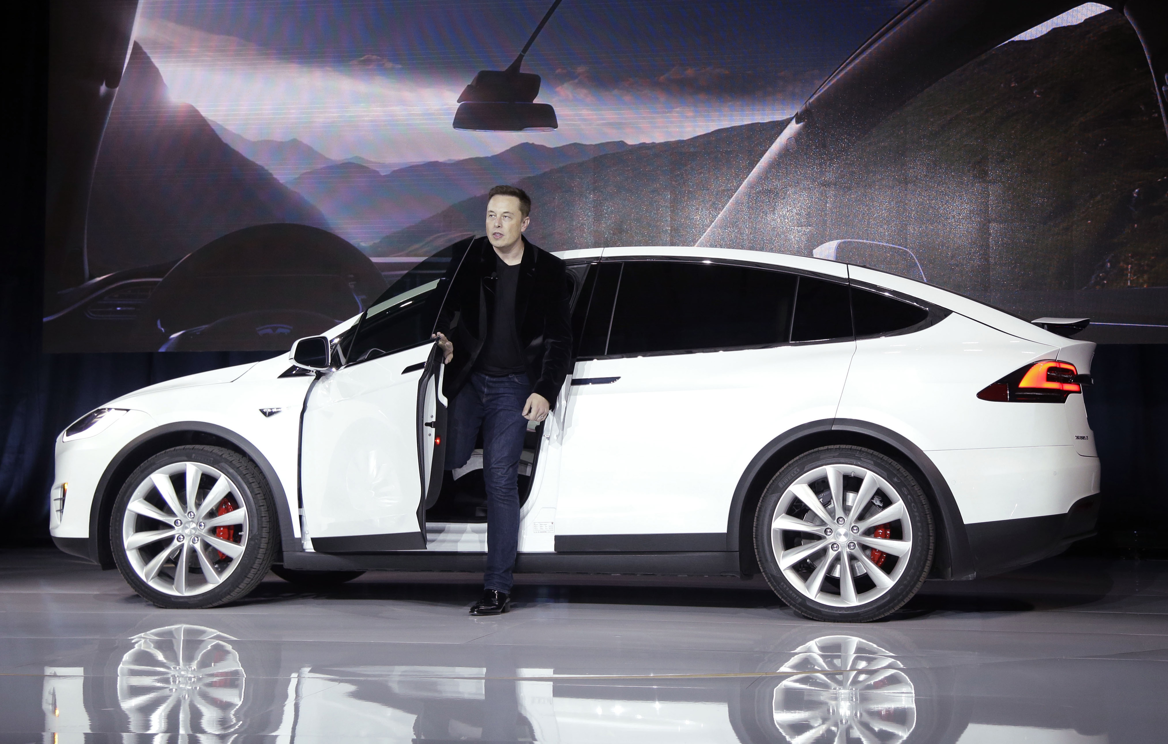 FILE - In this Sept. 29, 2015 file photo, Elon Musk, CEO of Tesla Motors Inc., introduces the Model X car at the company's headquarters in Fremont, Calif. A Tesla in Autopilot mode can drive itself but it's not a "self-driving" vehicle, at least as far as safety regulators are concerned. So, instead of coming under heavy government scrutiny before being sold to the public, Tesla can mass-produce cars that automatically adjust speed with the flow of traffic, keep their lane and slam the brakes in an emergency. (AP Photo/Marcio Jose Sanchez, File) (AP)