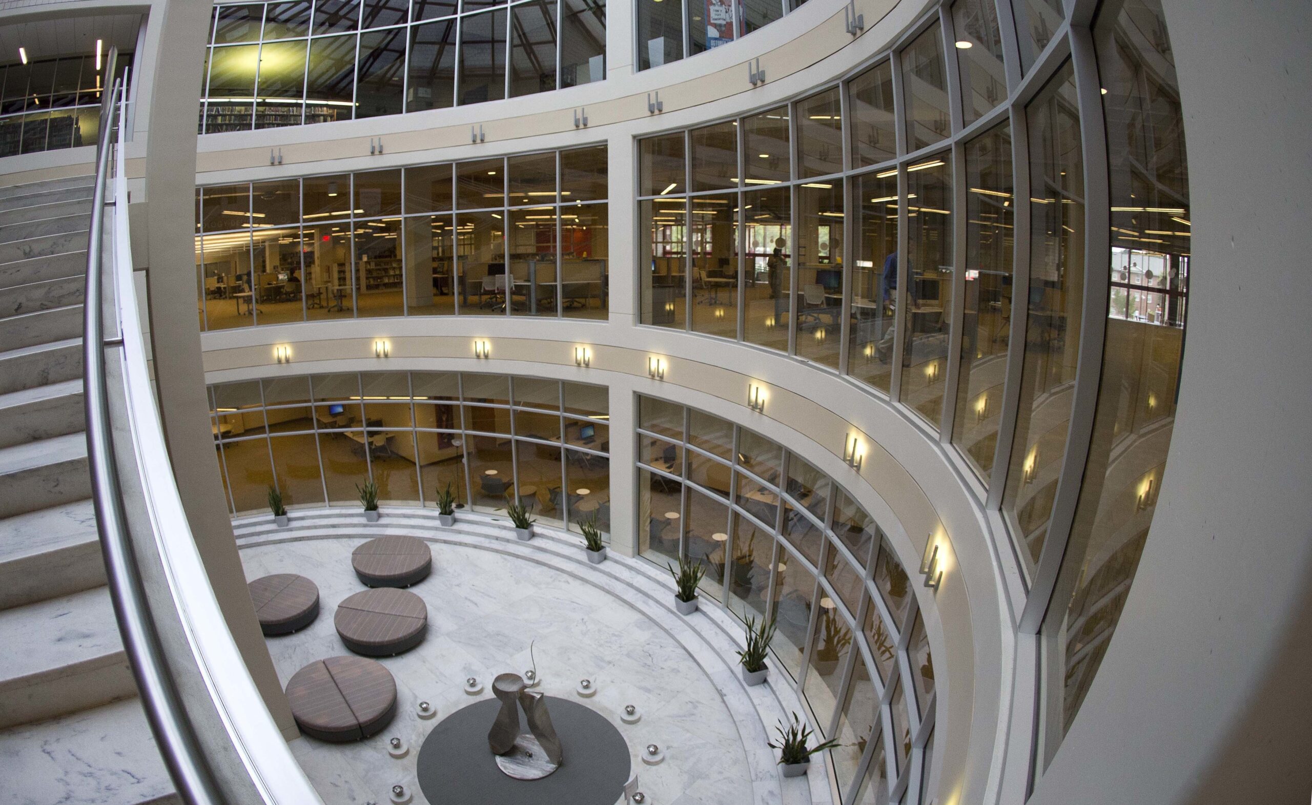 This Thursday, May 12, 2016 photo shows the glass-enclosed atrium at the Robert W. Woodruff Library in Atlanta. The design preserves the library's monumental marble stair case and allows more sunlight into the building, while also reducing the amount of noise inside. (AP Photo/John Bazemore) (AP)