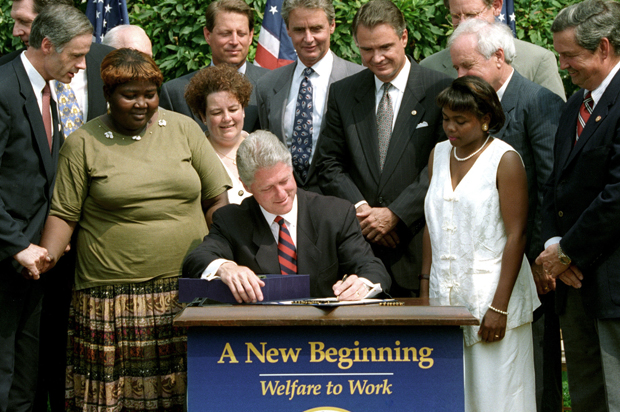 President Bill Cllinton signs the Personal Responsibility and Work Opportunity Act into law, August 22, 1996. (Reuters/Stephen Jaffe)