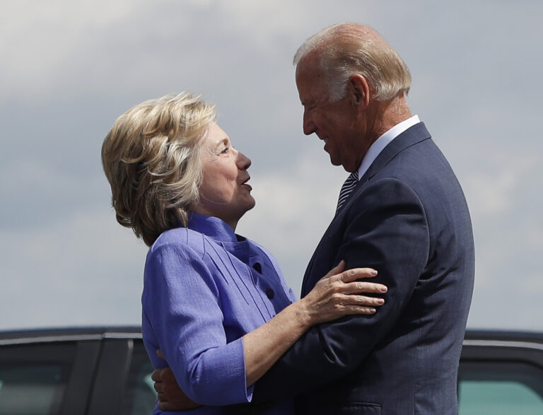 Democratic presidential candidate Hillary Clinton greets Vice President Joe Biden on the tarmac at Wilkes-Barre/Scranton International Airport in Avoca, Pa., Monday, Aug. 15, 2016, before traveling together to a campaign event in Scranton, Pa. (AP Photo/Carolyn Kaster) (AP)