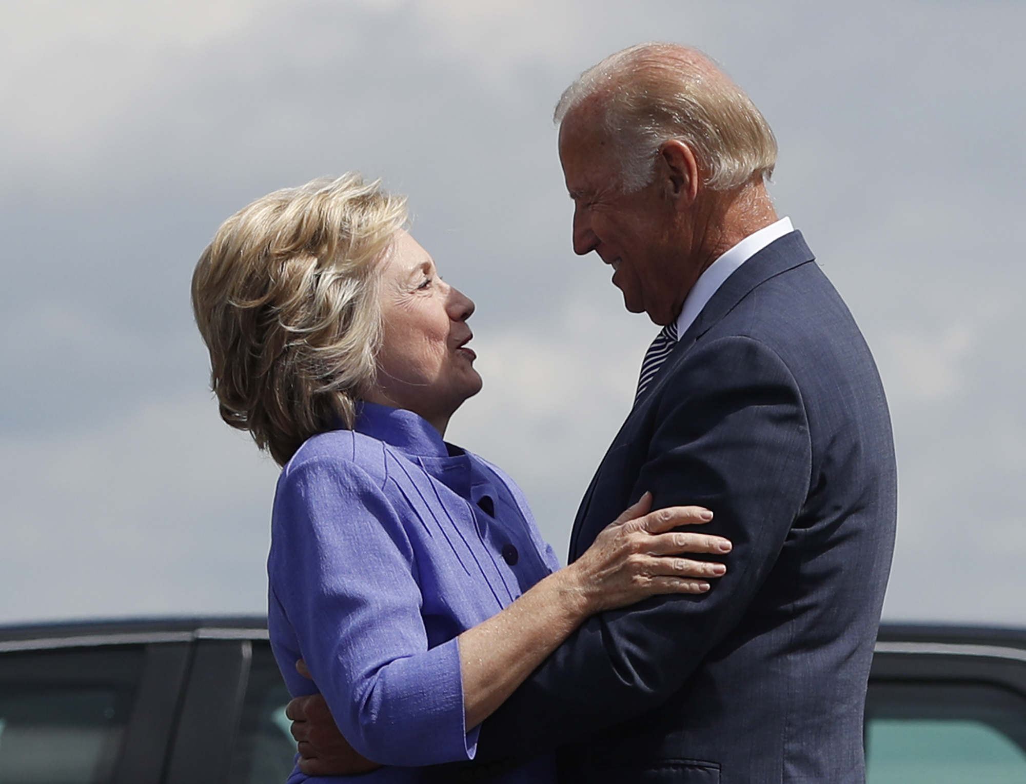 Democratic presidential candidate Hillary Clinton greets Vice President Joe Biden on the tarmac at Wilkes-Barre/Scranton International Airport in Avoca, Pa., Monday, Aug. 15, 2016, before traveling together to a campaign event in Scranton, Pa. (AP Photo/Carolyn Kaster) (AP)