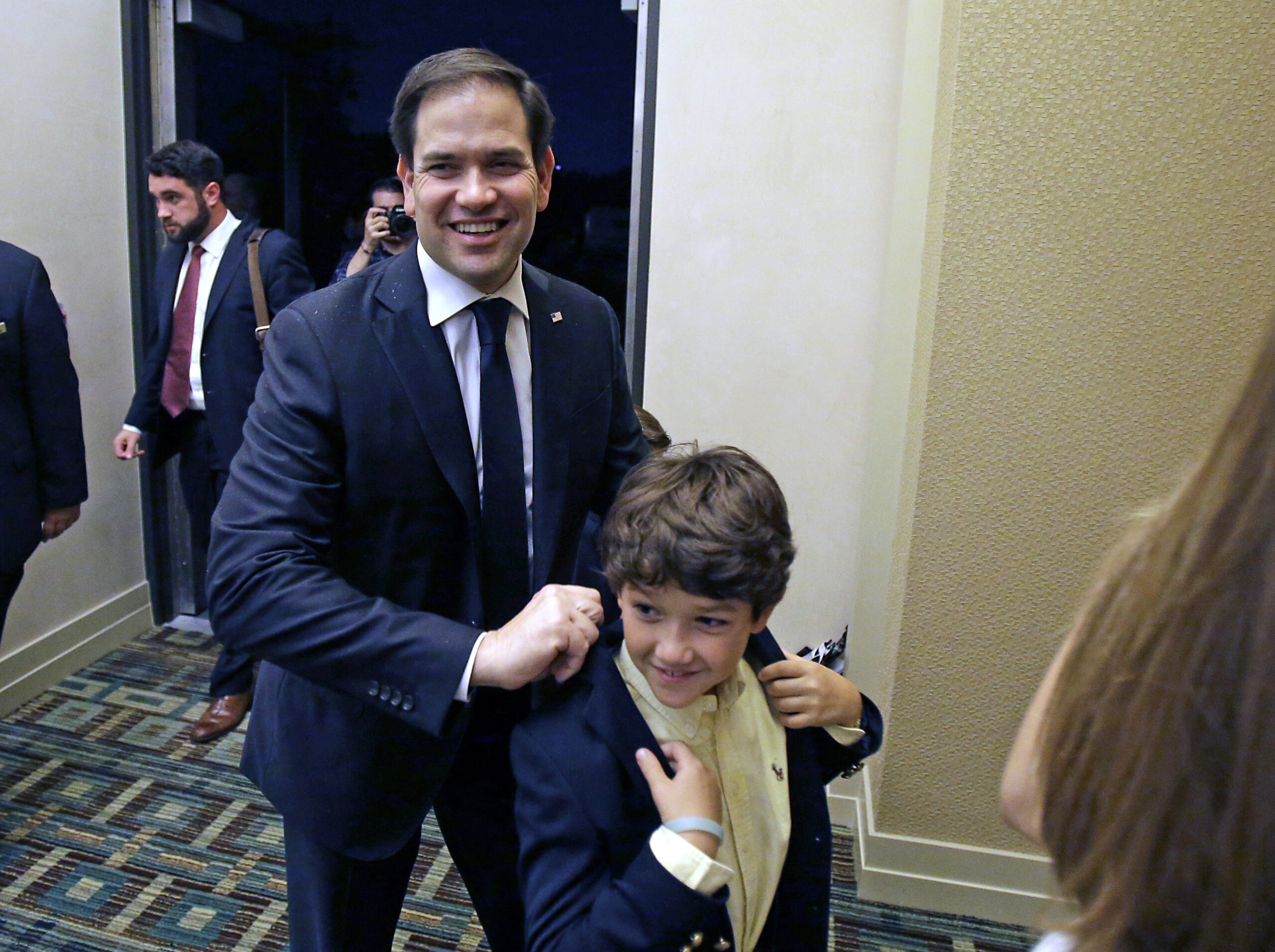 Sen. Marco Rubio, R-Fla., arrives with members of his family to a primary election party, Tuesday, Aug. 30, 2016, in Kissimmee, Fla. (AP)