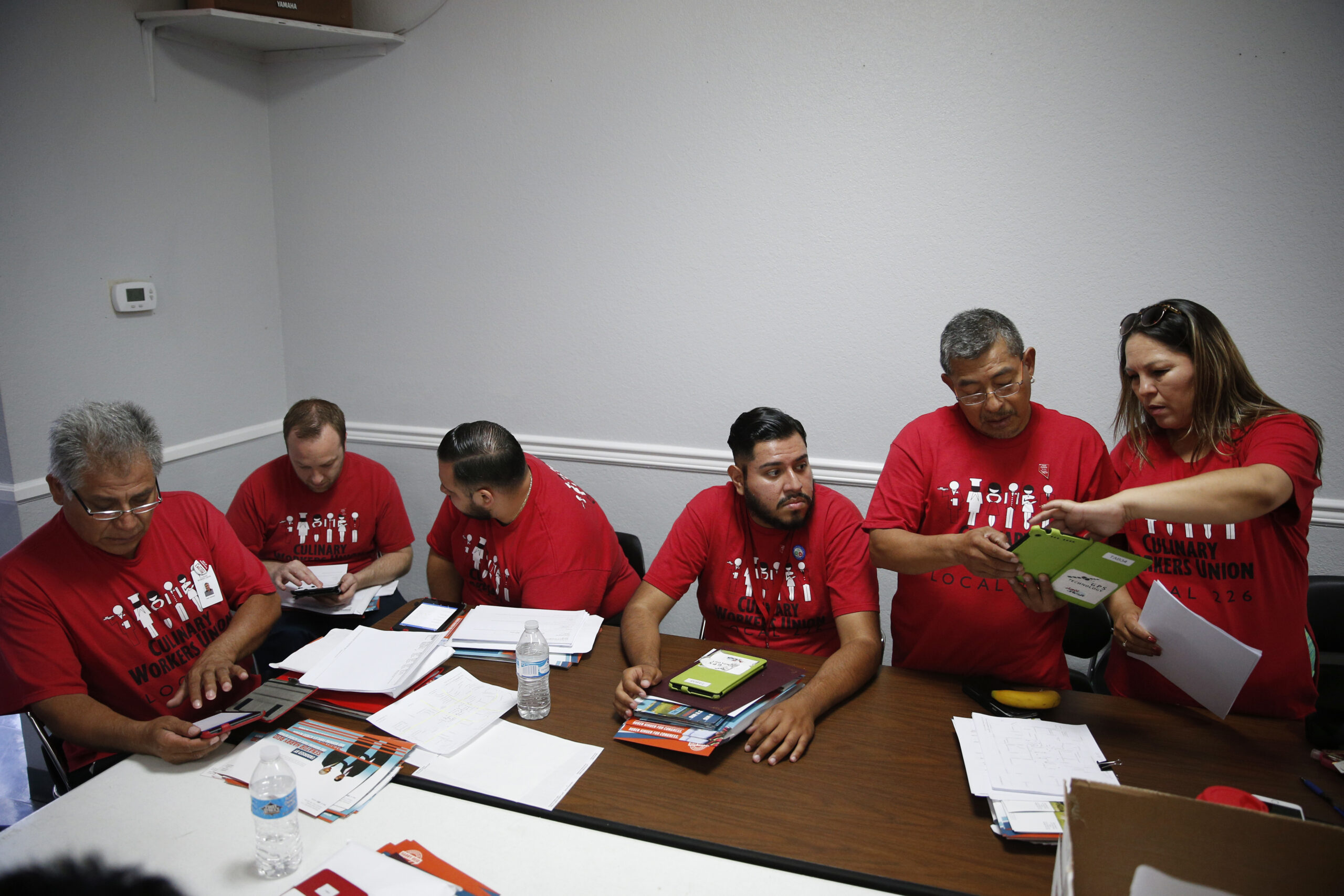 In this June 13, 2016 photo, members of Culinary Union Local 226 meet at their union hall in Las Vegas to prepare to canvass for Ruben Kihuen, a Hispanic candidate for congress. Half of the union's predominantly-immigrant members are Hispanic, and it has harnessed Sin City's housekeepers, cooks and janitors and turned them into an electoral powerhouse. (AP Photo/John Locher) (AP)