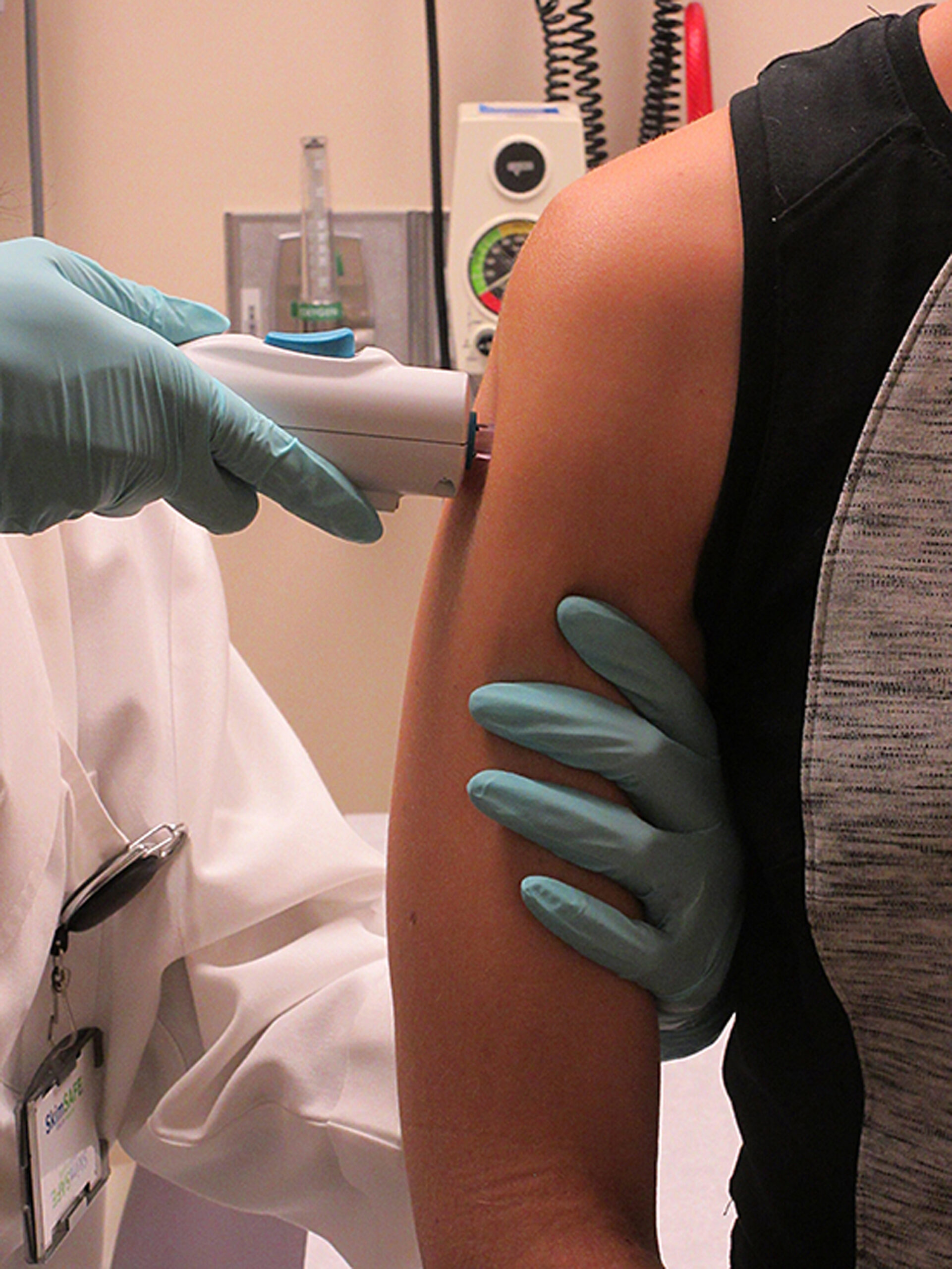 In this photo provided ​by The National Institute of Allergy and Infectious Diseases shows a healthy volunteer receiving the NIAID Zika virus investigational DNA vaccine as part of an early-stage trial to test the vaccine's safety and immunogenicity. This is the first administration of this vaccine in a human. (​The National Institute of Allergy and Infectious Diseases via AP) (AP)