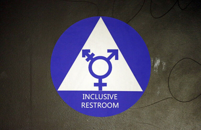 FILE - In this May 17, 2016, file photo, a new sticker designates a gender neutral bathroom at Nathan Hale high school in Seattle. A federal judge in Texas is blocking for now the Obama administration's directive to U.S. public schools that transgender students must be allowed to use the bathrooms and locker rooms consistent with their chosen gender identity. () (AP Photo/Elaine Thompson, File)