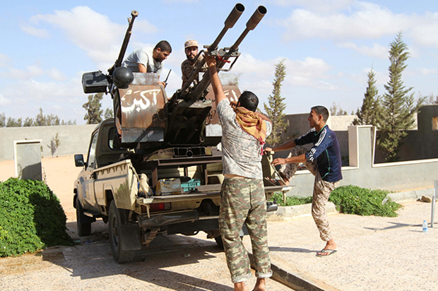 Libyan fighters from the Bonyan Marsous Brigades prepare their weapons before a battle with Islamic State fighters in neighborhood Number Two in Sirte, Libya, August 24, 2016. (Reuters/Hani Amara)