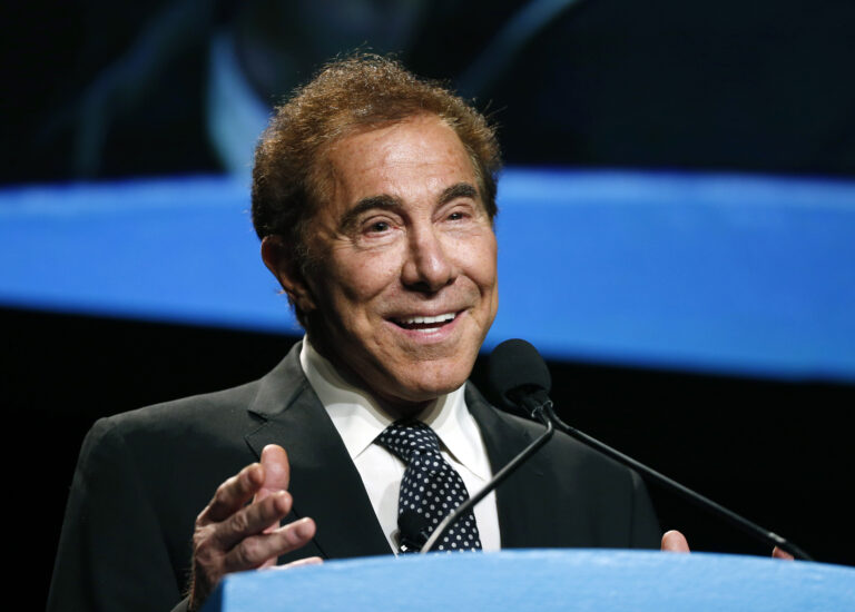 FILE - In this Jan. 15, 2015, file photo, Steve Wynn, CEO of Wynn Resorts, delivers the keynote address at Colliers International Annual Seminar at the Boston Convention Center in Boston. From a pair of giant golden dragons on the edge of a vast man-made lagoon to phoenix and cloud motifs throughout the interior, Wynn’s new multibillion dollar Macau resort brims with auspicious Chinese symbolism. The U.S. casino mogul will be hoping luck is on his side as he prepares to launch his Wynn Palace project in the Asian gambling hub, where growth is downshifting into a new phase after years of turbocharged expansion. (AP Photo/Elise Amendola, File) (AP)