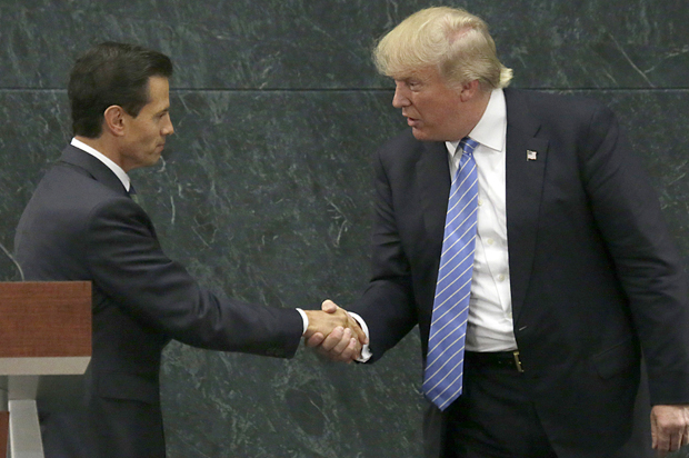 Mexico President Enrique Pena Nieto and Donald Trump shake hands after a joint statement in Mexico City, Aug. 31, 2016. (AP/Marco Ugarte)