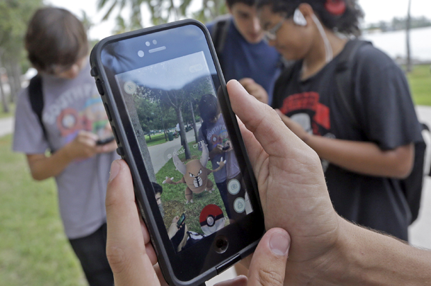 Common Sense Media says don't worry so much about your kids online (AP/Alan Diaz)