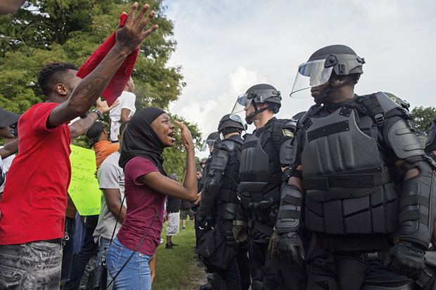 Protesters confront police officers in Baton Rouge, July 9, 2016. (AP/Max Becherer)