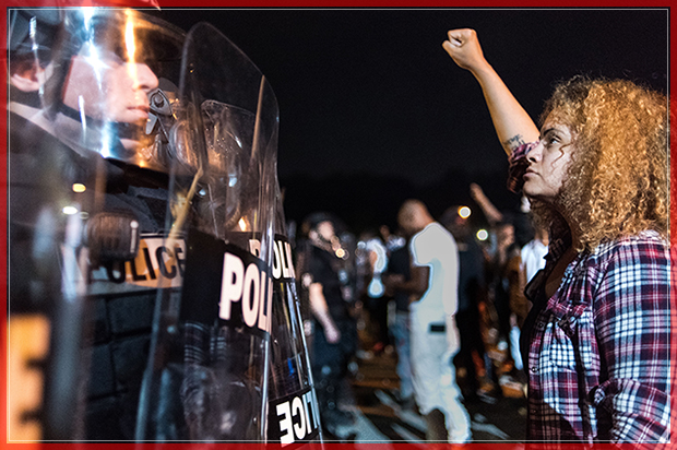 CHARLOTTE, NC - SEPTEMBER 21: Police officers face off with protestors  on the I-85 (Interstate 85) during protests following the death of a man shot by a police officer on September 21, 2016 in Charlotte, NC. The protests began the previous night following the fatal shooting of 43-year-old Keith Lamont Scott at an apartment complex near UNC Charlotte. (Photo by Sean Rayford/Getty Images) (Getty Images)