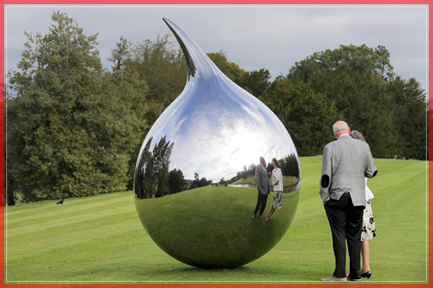 CHATSWORTH, ENGLAND - SEPTEMBER 09:  The Duke and Duchess of Devonshire view Tear, by artist Richard Hudson, one of the many moumental sculptures on dispay at Chatsworth stately home as part of the Sotheby's Beyond Limits Monumental Outdoor Sculpture Show on September 9, 2016 in Chatsworth, England. Work by world-renowned artists including Zaha Hadid, Aristide Maillol, Bruce Munro, Richard Hudson, Cristina Iglesias and Joana Vasconcelos, are on display as part of the Sotheby's Beyond Limits Monumental Outdoor Sculpture Show in the gardens of Chatsworth between 10 September and 30 October 2016.  Sotheby's Beyond Limits selling exhibition, has firmly established itself as one of the most prestigious platforms for the display and sale of modern and contemporary outdoor sculpture, and a key event in the art world calendar. The show brings together works by leading pioneers in this field, all situated in the historic garden of one of Europes greatest country estates, the ancestral seat of the Duke and Duchess of Devonshire.  (Photo by Christopher Furlong/Getty Images for Sotheby's) (Getty Images For Sotheby's)