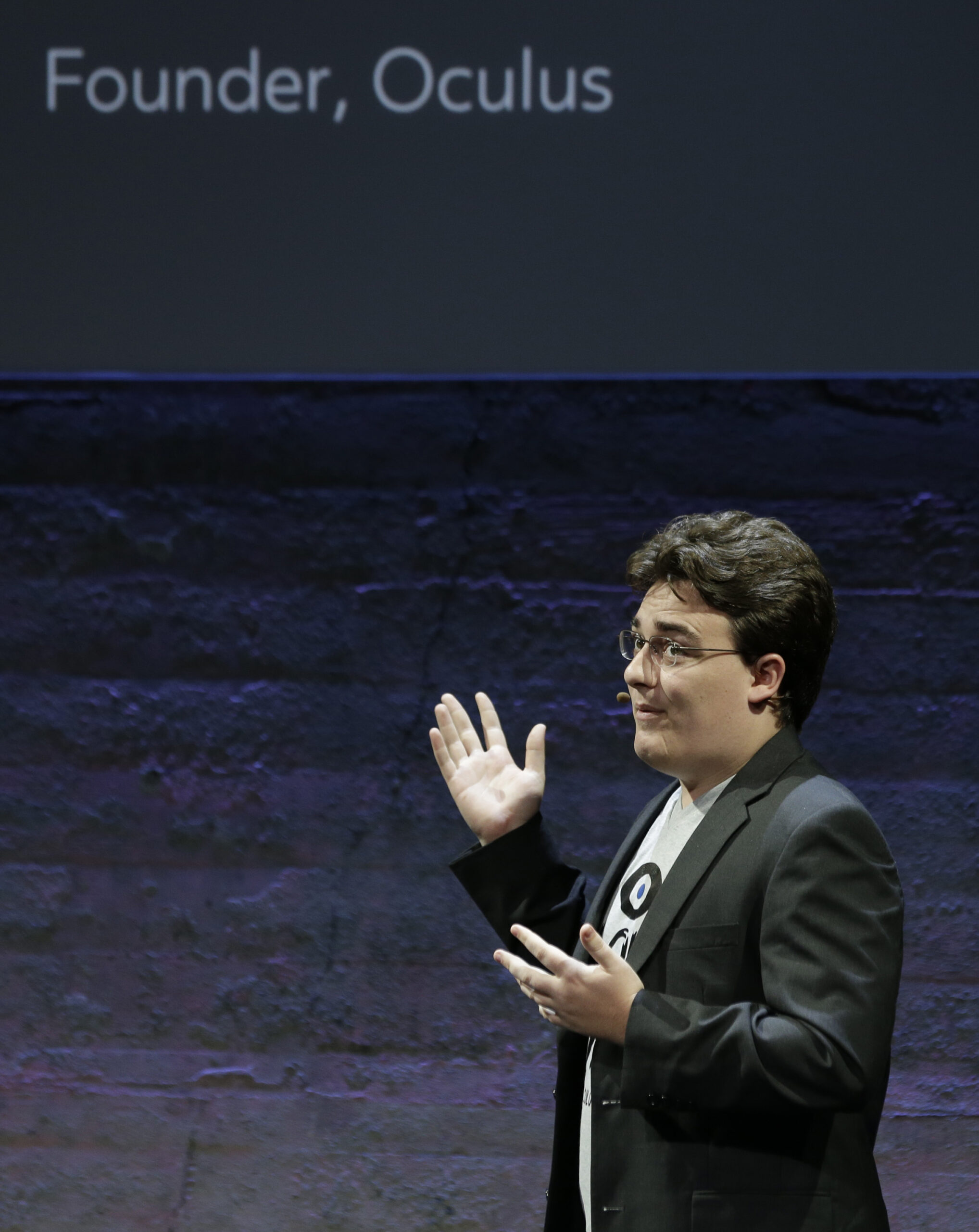 Oculus Founder Palmer Luckey talks about the Rift virtual-reality headset during a news conference Thursday, June 11, 2015, in San Francisco. Oculus is expanding its highly anticipated virtual-reality headset to simulate the sensation of touch and gesturing as part of its quest to blur the lines between the fake and genuine world. (AP Photo/Eric Risberg) (Associated Press)
