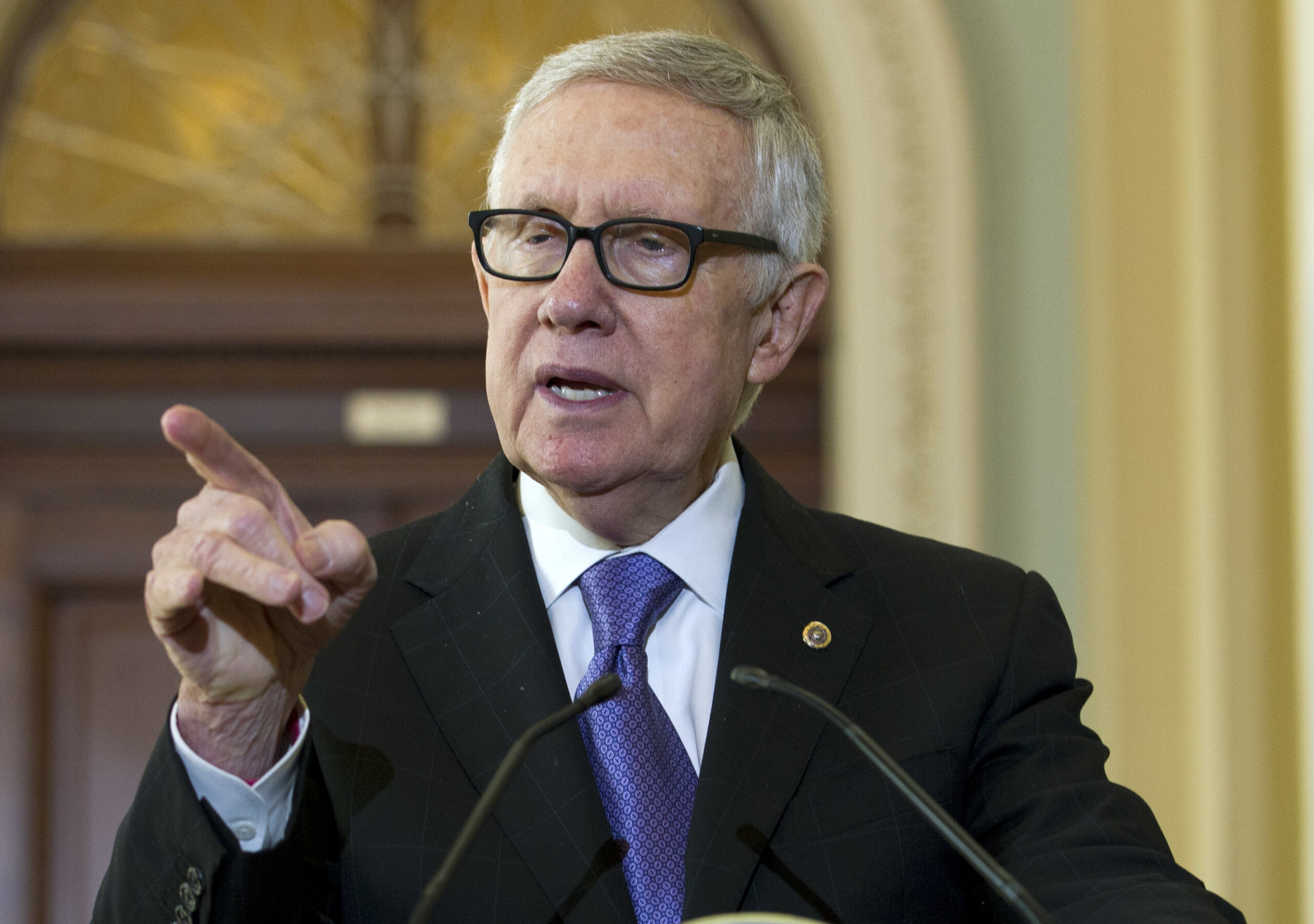 FILE - In this Sept. 14, 2016 file photo, Senate Minority Leader Harry Reid of Nev. speaks during a news conference on Capitol Hill in Washington. Reid lashed out at Donald Trump as a “con artist” after the Republican presidential nominee suggested the lawmaker resume exercising with the equipment that left him blind in one eye last year. (AP Photo/Jose Luis Magana, File) (AP)