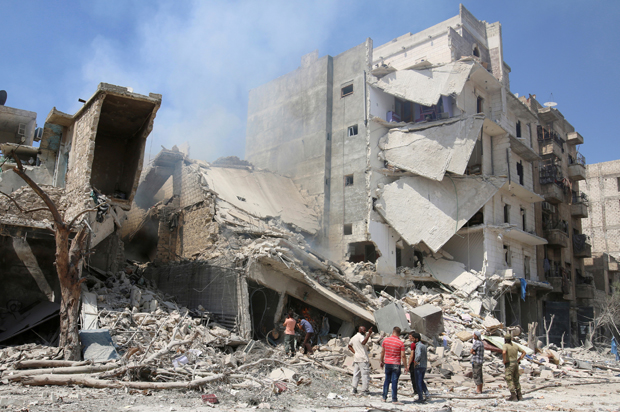 Men inspect a damaged site after double airstrikes on the rebel held Bab al-Nairab neighborhood of Aleppo, Syria, August 27, 2016. (Reuters/Abdalrhman Ismail)