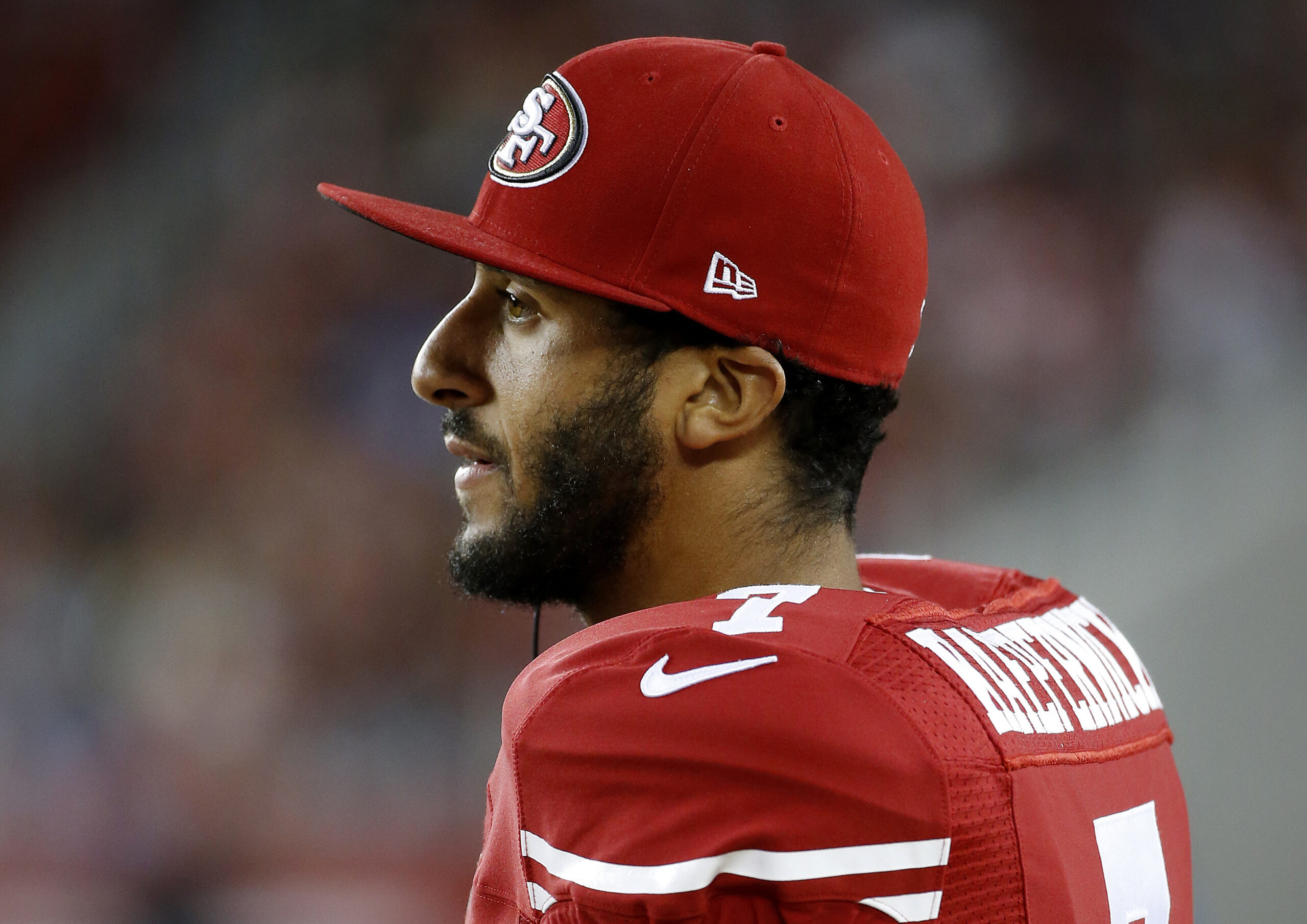 FILE - In this Sept. 3, 2015 file photo, San Francisco 49ers quarterback Colin Kaepernick watches from the sideline during the second half of an NFL preseason football game against the San Diego Chargers in Santa Clara, Calif. Kaepernick's decision this week to refuse to stand during the playing of the national anthem as a way of protesting police killings of unarmed black men has drawn support and scorn far beyond sports.  (AP Photo/Tony Avelar, File) (AP)