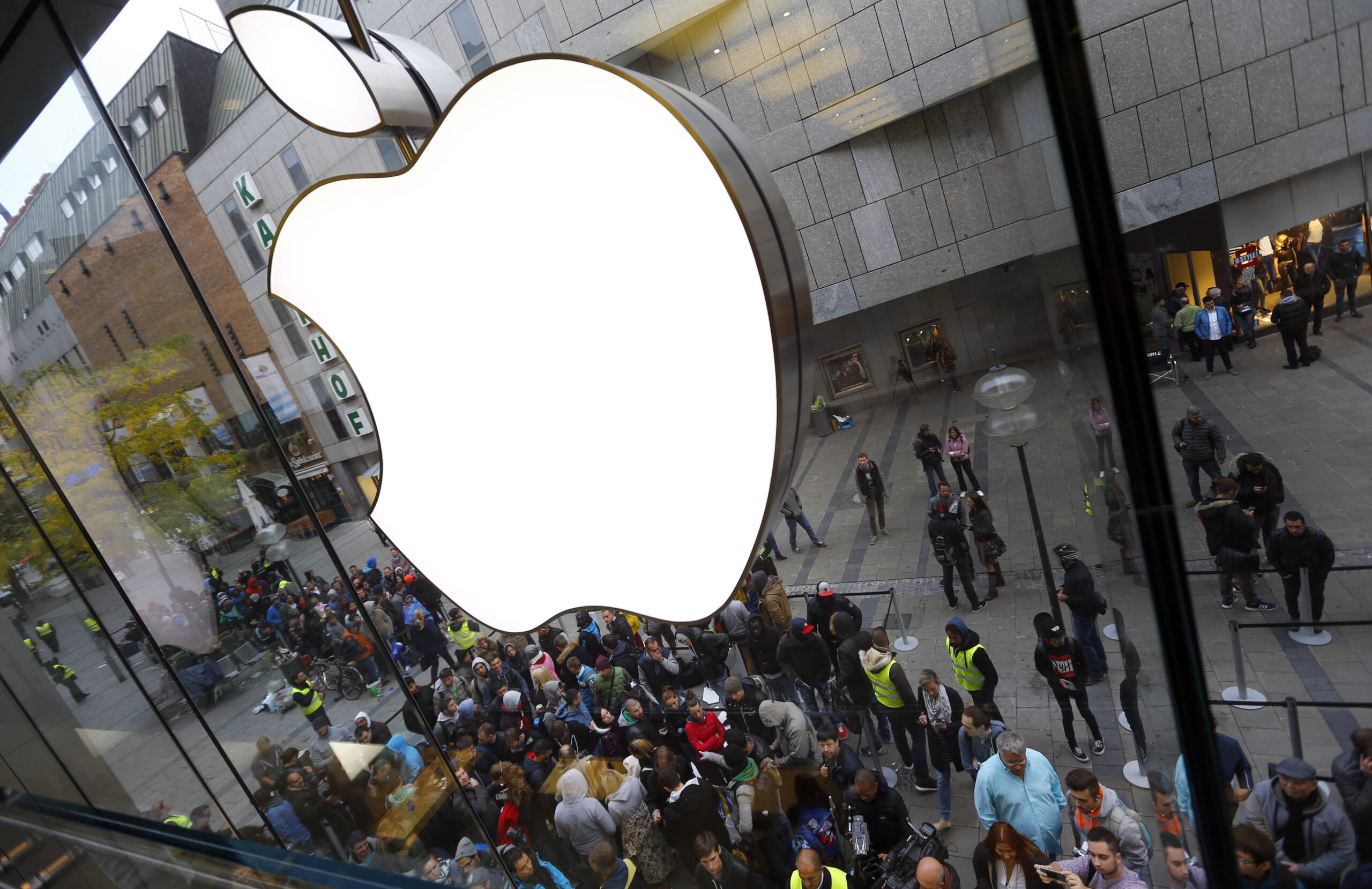 FILE - In this Friday, Sept. 25, 2015, file photo, people wait in front of an Apple store in Munich, before the worldwide launch of the iPhone 6s. After a tax ruling against Apple on Tuesday, Aug. 30, 2016, the spotlight turns to dozens of companies that have boosted earnings taking advantage of low tax rates abroad. (AP Photo/Matthias Schrader, File) (AP)