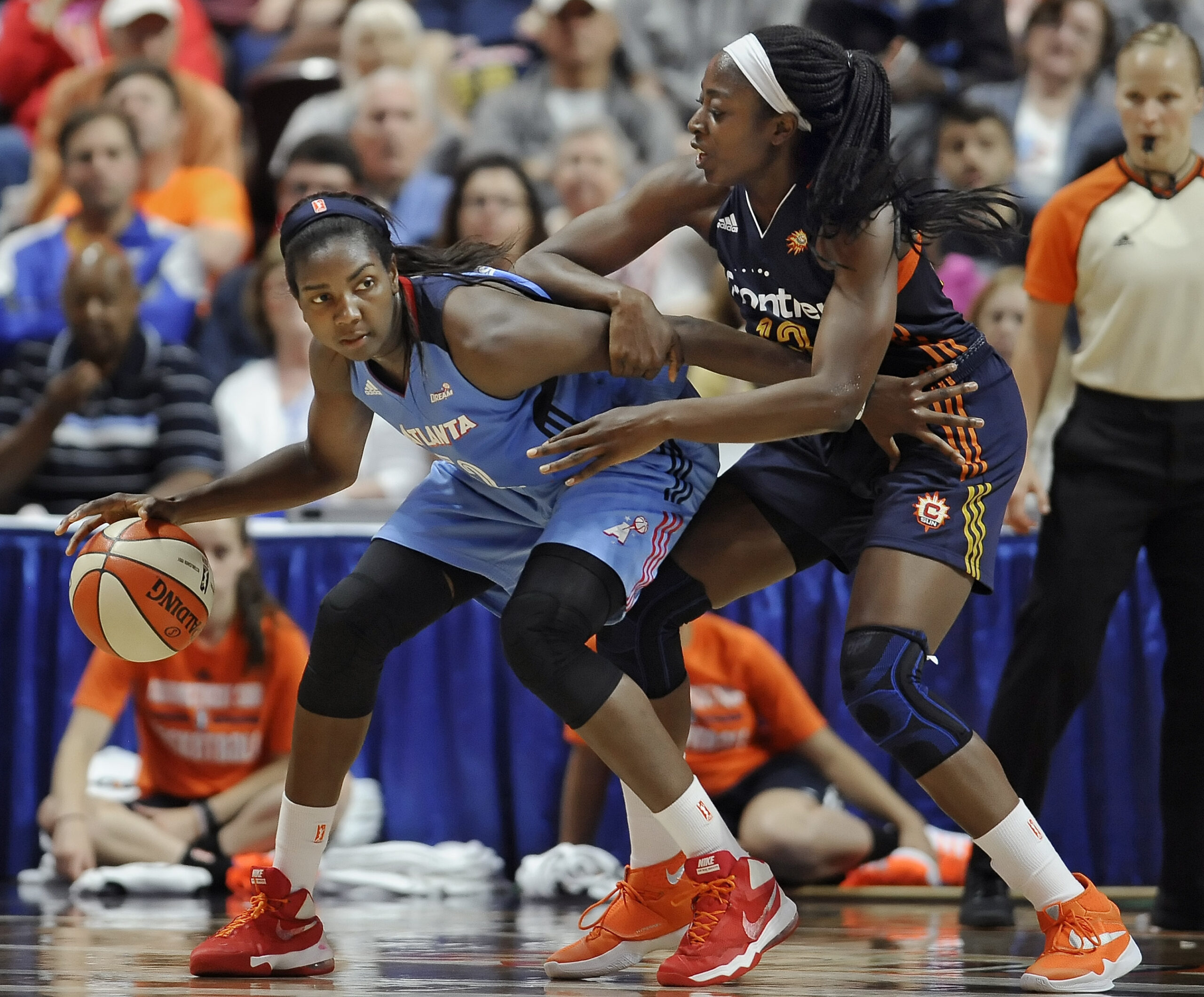 FILE - In this July 10, 2016, file photo, Atlanta Dream's Elizabeth Williams, left, is guarded by Connecticut Sun's Chiney Ogwumike during the second half of a WNBA basketball game in Uncasville, Conn. Atlanta’s Elizabeth Williams was voted the most improved player, Tuesday, Sept. 20, 2016. (AP Photo/Jessica Hill, File) (AP)