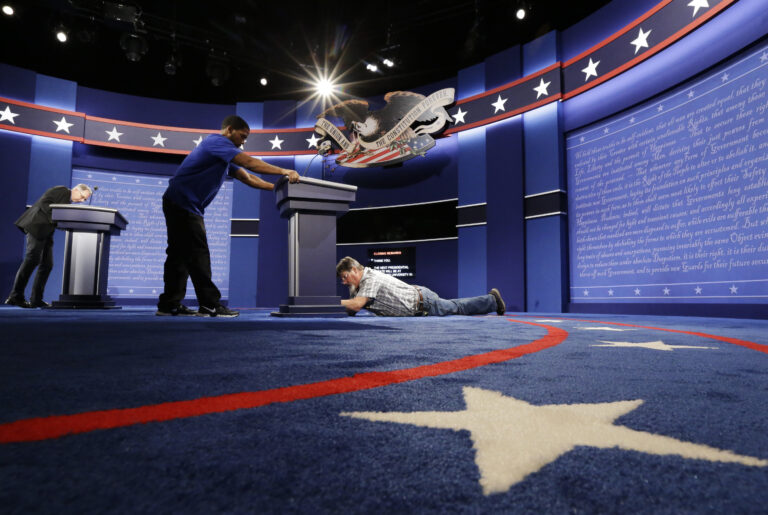 Technicians set up the stage for the presidential debate between Democratic presidential candidate Hillary Clinton and Republican presidential candidate Donald Trump at Hofstra University in Hempstead, N.Y., Sunday, Sept. 25, 2016. (AP)