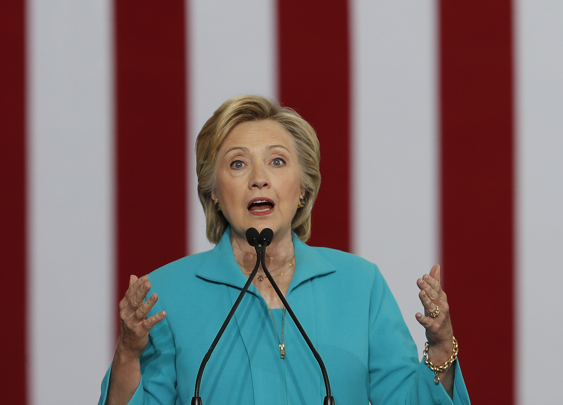 FILE - In this Aug. 25, 2016 file photo, Democratic presidential candidate Hillary Clinton speaks at a campaign event in Reno, Nev. The 2016 presidential election features two candidates with dramatically different approaches on immigration. In tone, Republican Donald Trump often highlights violent crimes perpetrated by immigrants in the country illegally with aggressive rhetoric that seizes on nationalism if not xenophobia. Democrat Hillary Clinton features a softer approach that embraces diversity and the value of keeping immigrant families together, even as her critics accuse her of promoting “open borders.” (AP Photo/Carolyn Kaster, File) (AP Photo/Carolyn Kaster, File)