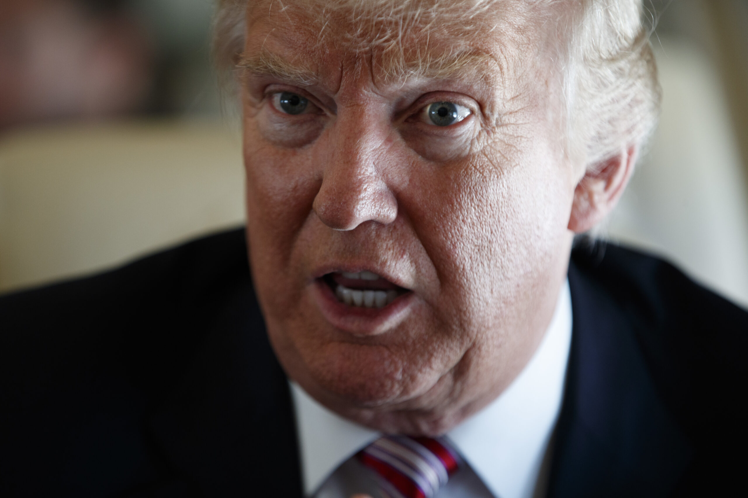 Republican presidential candidate Donald Trump speaks with members of the press, Monday, Sept. 5, 2016, aboard his campaign plane, while flying over Ohio. (AP Photo/Evan Vucci) (AP Photo/Evan Vucci)