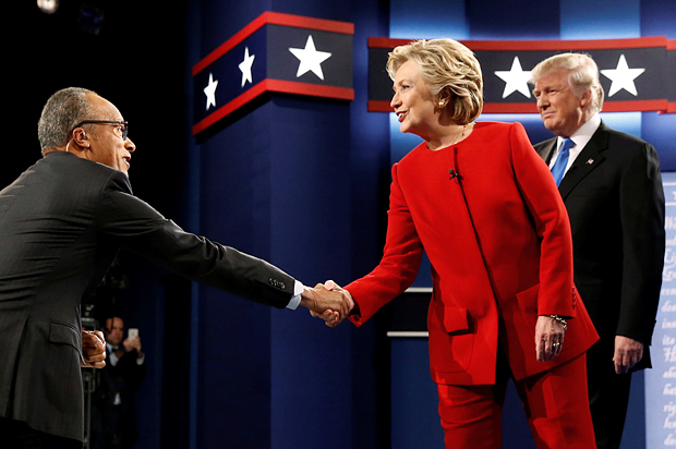 Hillary Clinton greets moderator Lester Holt of NBC News as she and Donald Trump take the stage for their first debate in Hempstead, New York, September 26, 2016. (Reuters/Jonathan Ernst)