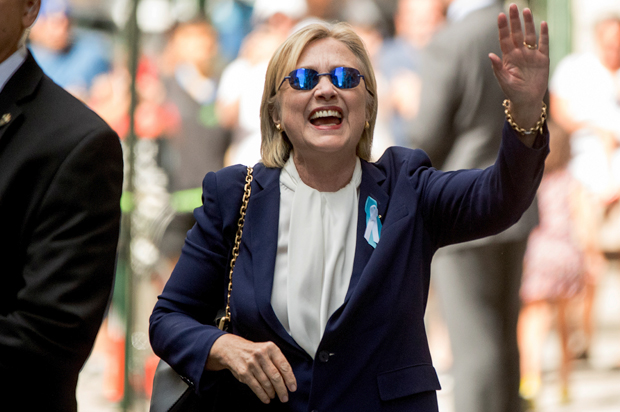 Hillary Clinton waves after leaving an apartment building Sunday, Sept. 11, 2016, in New York. (AP/Andrew Harnik)