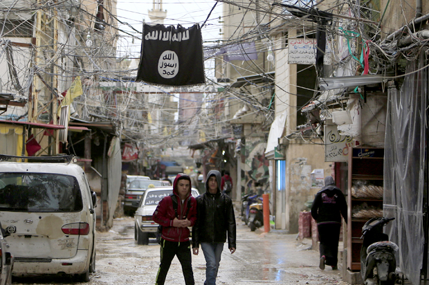 An Islamic State flag hangs in Ain al-Hilweh Palestinian refugee camp, near Sidon, (Reuters/Ali Hashisho)