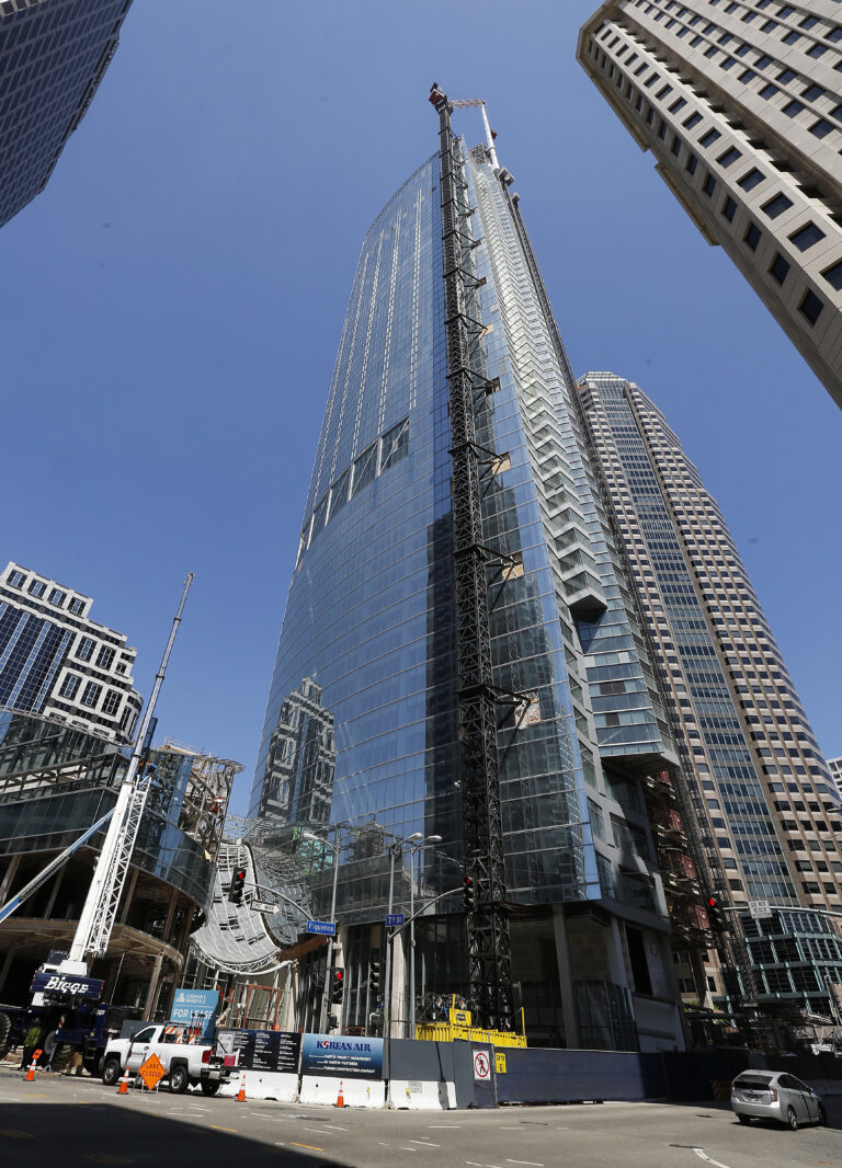 A 160-foot spire is seen atop the Wilshire Grand Tower building after a crane hoisted it into place early Saturday, Sept. 3, 2016. (AP Photo/Reed Saxon)