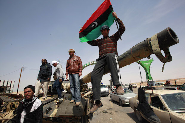 Libyan rebels on a tank outside the town of Ajdabiyah on March 26, 2011 (Reuters/Andrew Winning)