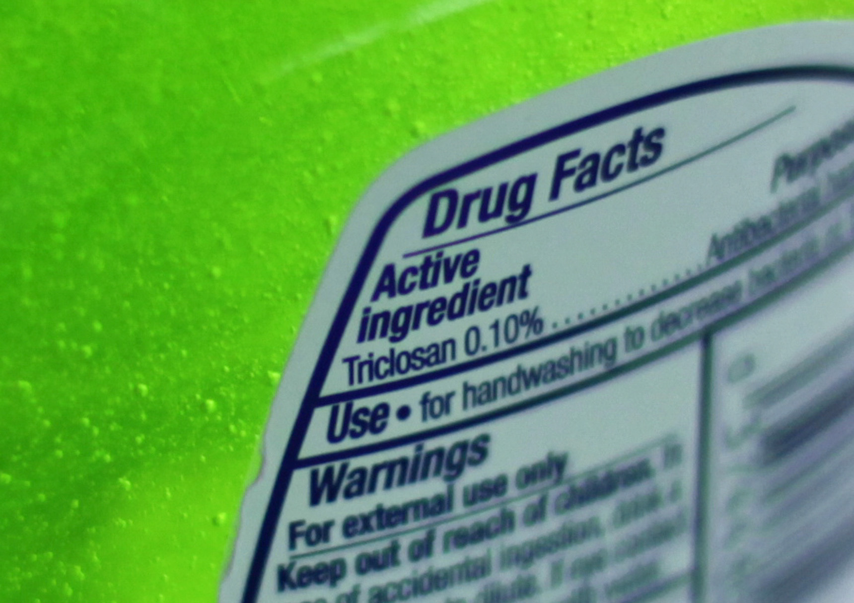 FILE - This Tuesday, April 30, 2013 file photo shows the label of a bottle of antibacterial soap in a kitchen in Chicago. The U.S. government is banning more than a dozen chemicals, including triclosan, long-used in antibacterial soaps and washes, saying manufacturers have failed to show that they are safe and prevent the spread of germs. (AP Photo/Kiichiro Sato) (AP)