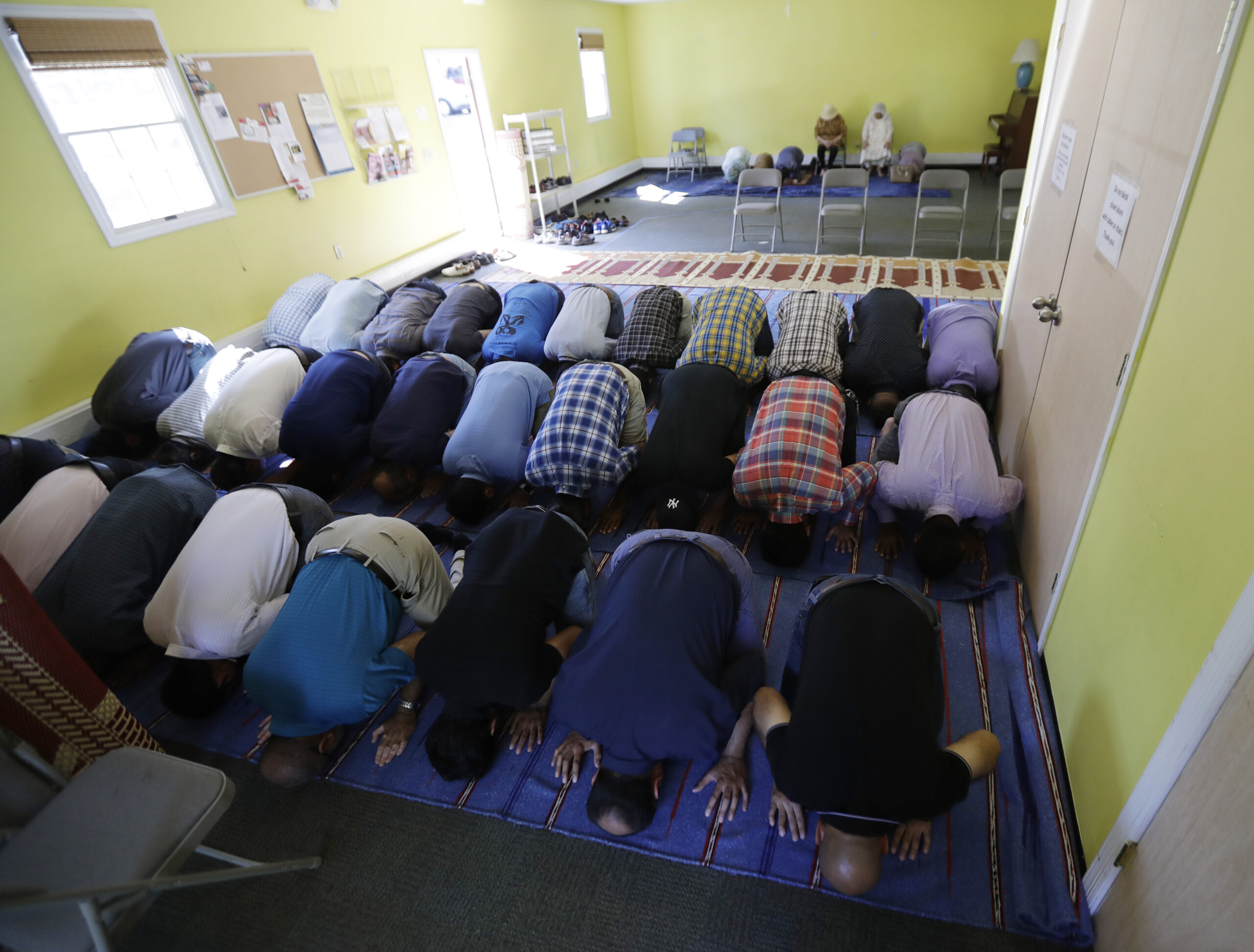 In a photo taken Friday, Sept. 23, 2016, in Basking Ridge, N.J., people pray during a service at the Bernards Township Community Center. (AP)