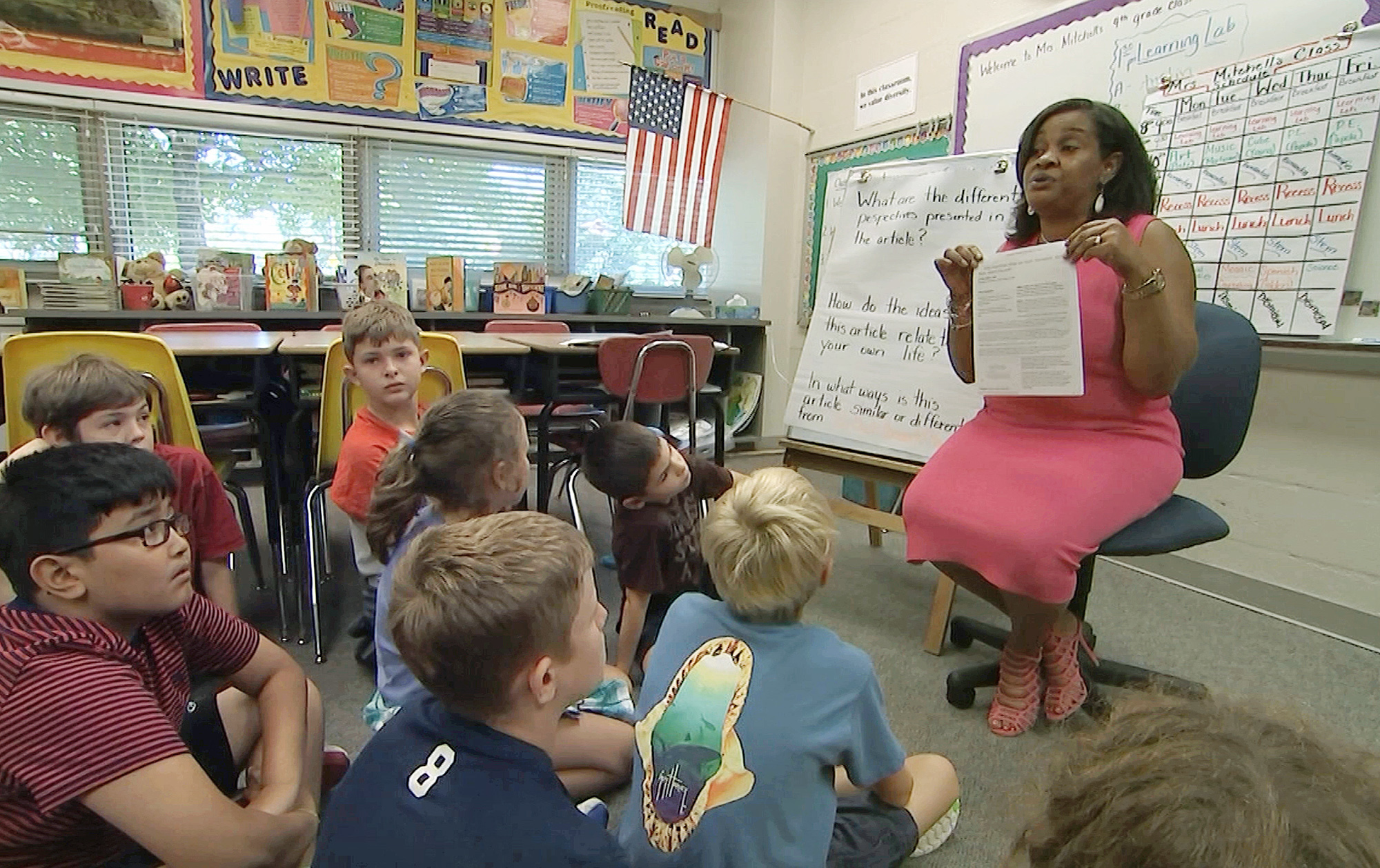 In this Tuesday, Sept. 13, 2016 still image from video, Kimberly Coleman-Mitchell, right, teaches her fourth grade class at Oakridge Elementary School in Arlington, Va. Elementary schools in Arlington, South Burlington, Vt., and Holyoke, Mass., are among those that went homework-free at the start of the school year. (AP Photo/Bill Gorman) (AP)