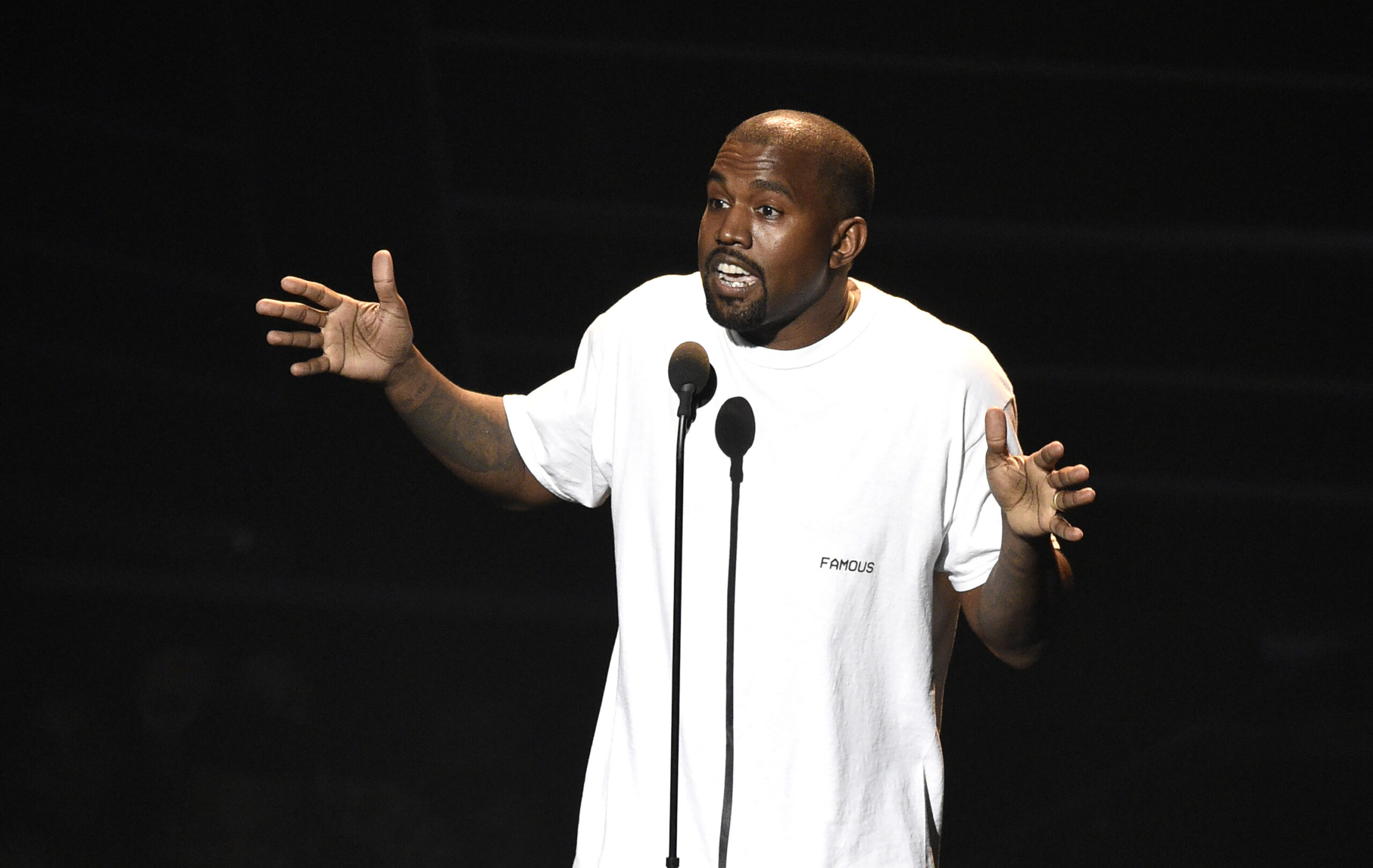 File-This Aug. 28, 2016, file photo shows Kanye West appearing at the MTV Video Music Awards at Madison Square Garden in New York. West brought his “Saint Pablo Tour” to the small stage at a New York Fashion Week party, where he performed Friday, Sept. 9, 2016, under smoky, dark lights, and ended his set with some outspoken words, per usual. 
(Photo by Chris Pizzello/Invision/AP, File) (AP)