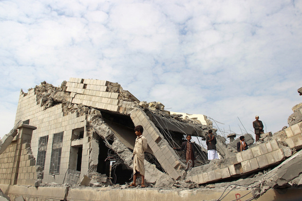 Yemenis stand on the rubble of a school destroyed by a U.S.-backed Saudi-led coalition air strike in an outskirt of the northwestern city of Saada, Yemen on September 14, 2016 (Reuters/Naif Rahma)