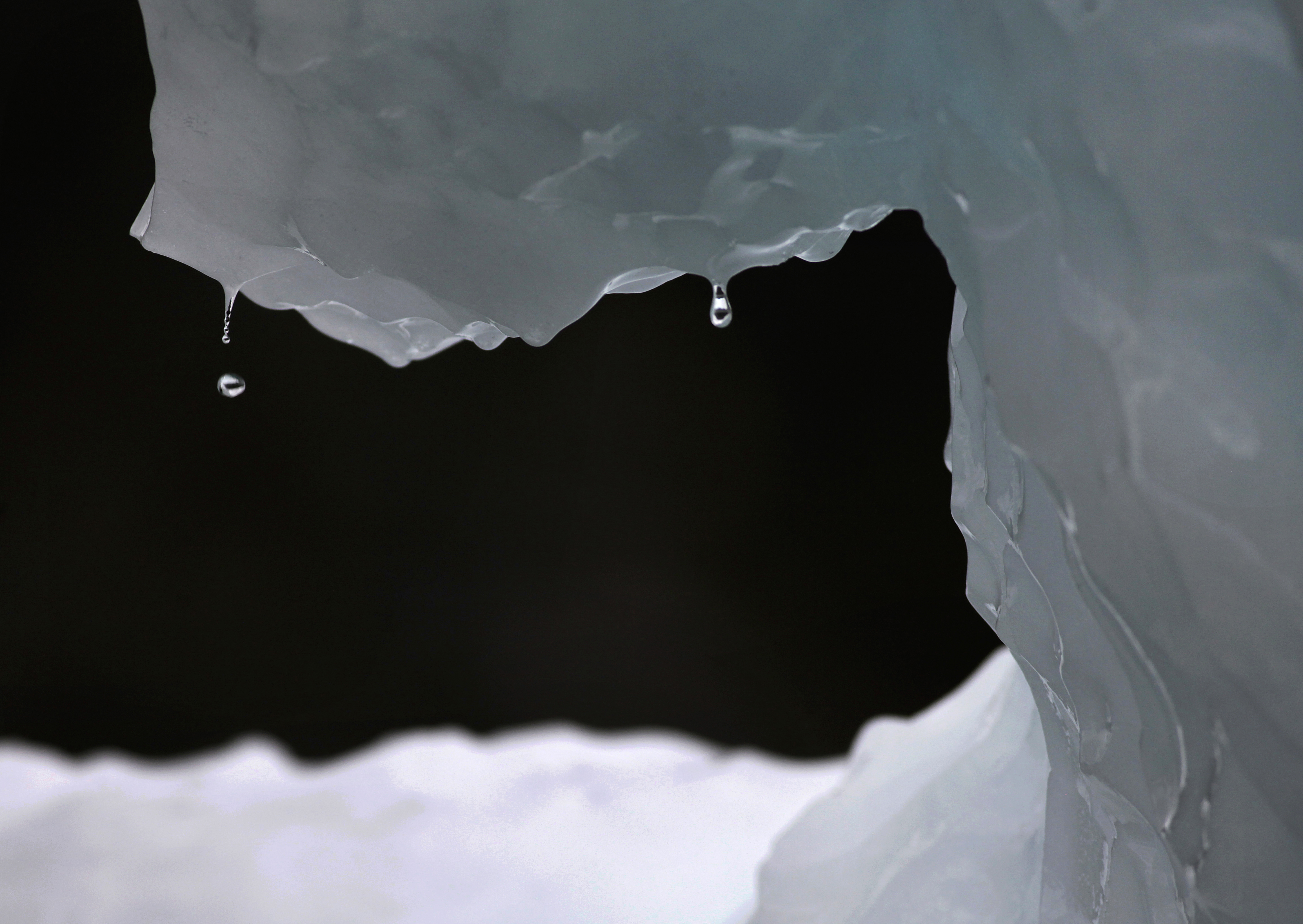 FILE - In this July 26, 2011 file photo, drops of water fall from a melting iceberg near Nuuk, Greenland. Greenhouse gases more powerful than carbon dioxide are the focus of a global gathering this week in Rwanda, with Secretary of State John Kerry expected to arrive Thursday, Oct. 13, 2016 to apply pressure for a deal to quickly phase out hydrofluorocarbons which are used in air conditioners, refrigerators, and insulating foams. (AP Photo/Brennan Linsley, File) (AP)