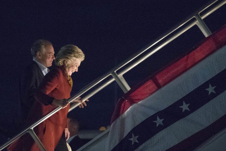 Democratic presidential candidate Hillary Clinton and Democratic vice presidential candidate Sen. Tim Kaine, D-Va. board the campaign airplane, Saturday, Oct. 22, 2016, in Pittsburgh, Pa. (AP Photo/Mary Altaffer) (AP)