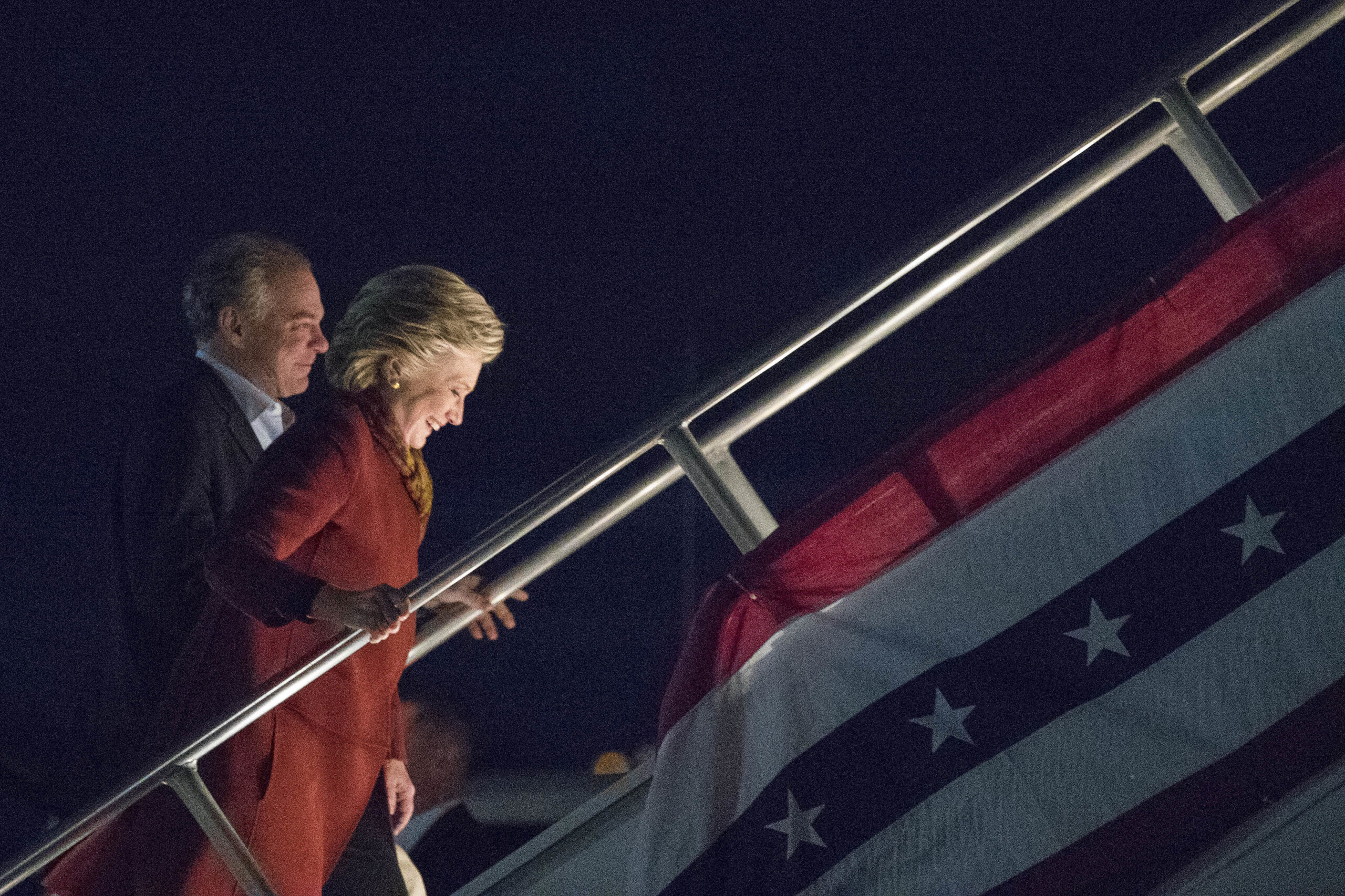 Democratic presidential candidate Hillary Clinton and Democratic vice presidential candidate Sen. Tim Kaine, D-Va. board the campaign airplane, Saturday, Oct. 22, 2016, in Pittsburgh, Pa. (AP Photo/Mary Altaffer) (AP)