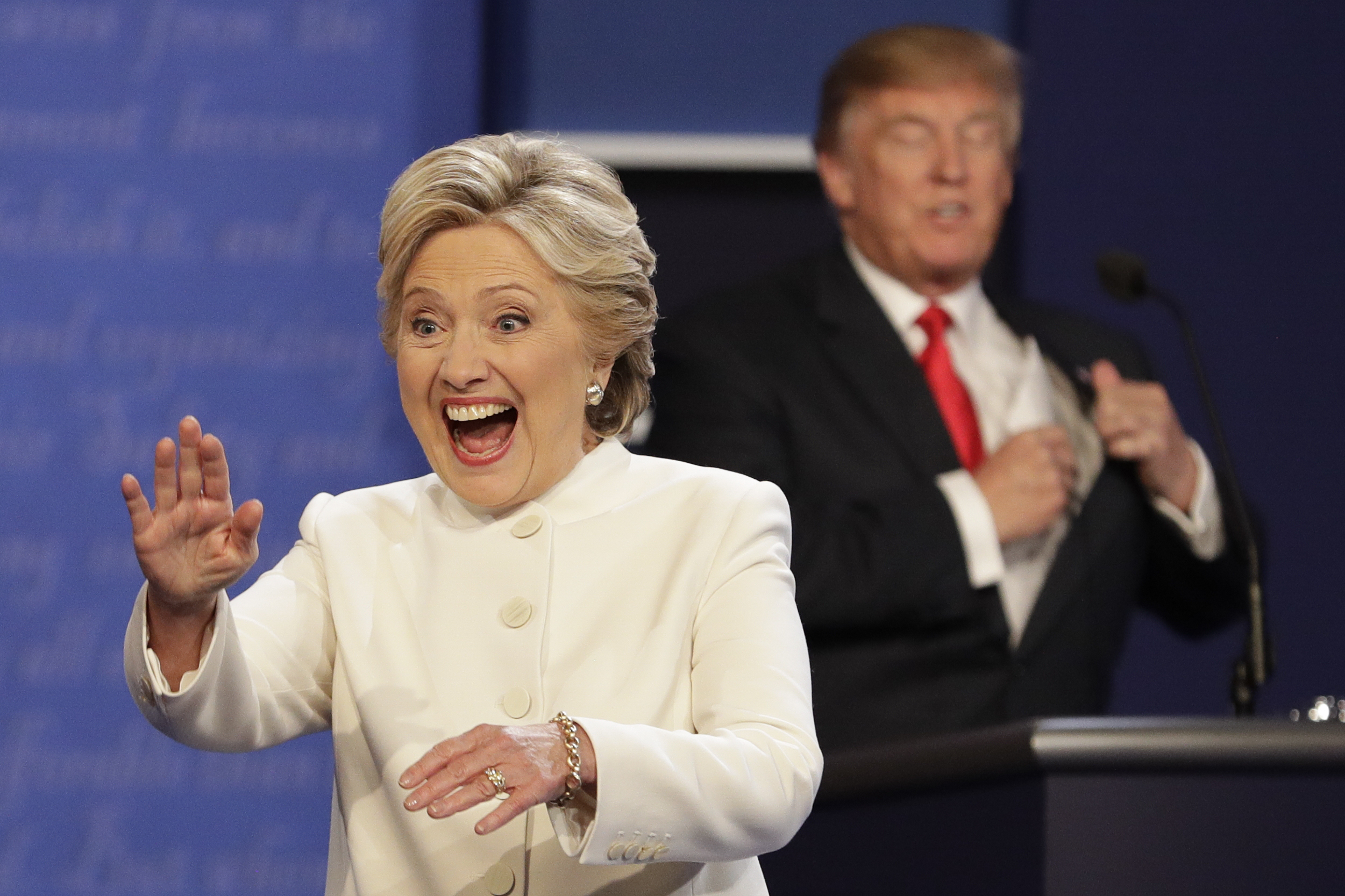 Democratic presidential nominee Hillary Clinton waves to the audience as Republican presidential nominee Donald Trump puts his notes away after the third presidential debate at UNLV in Las Vegas, Wednesday, Oct. 19, 2016. (AP Photo/John Locher) (AP)