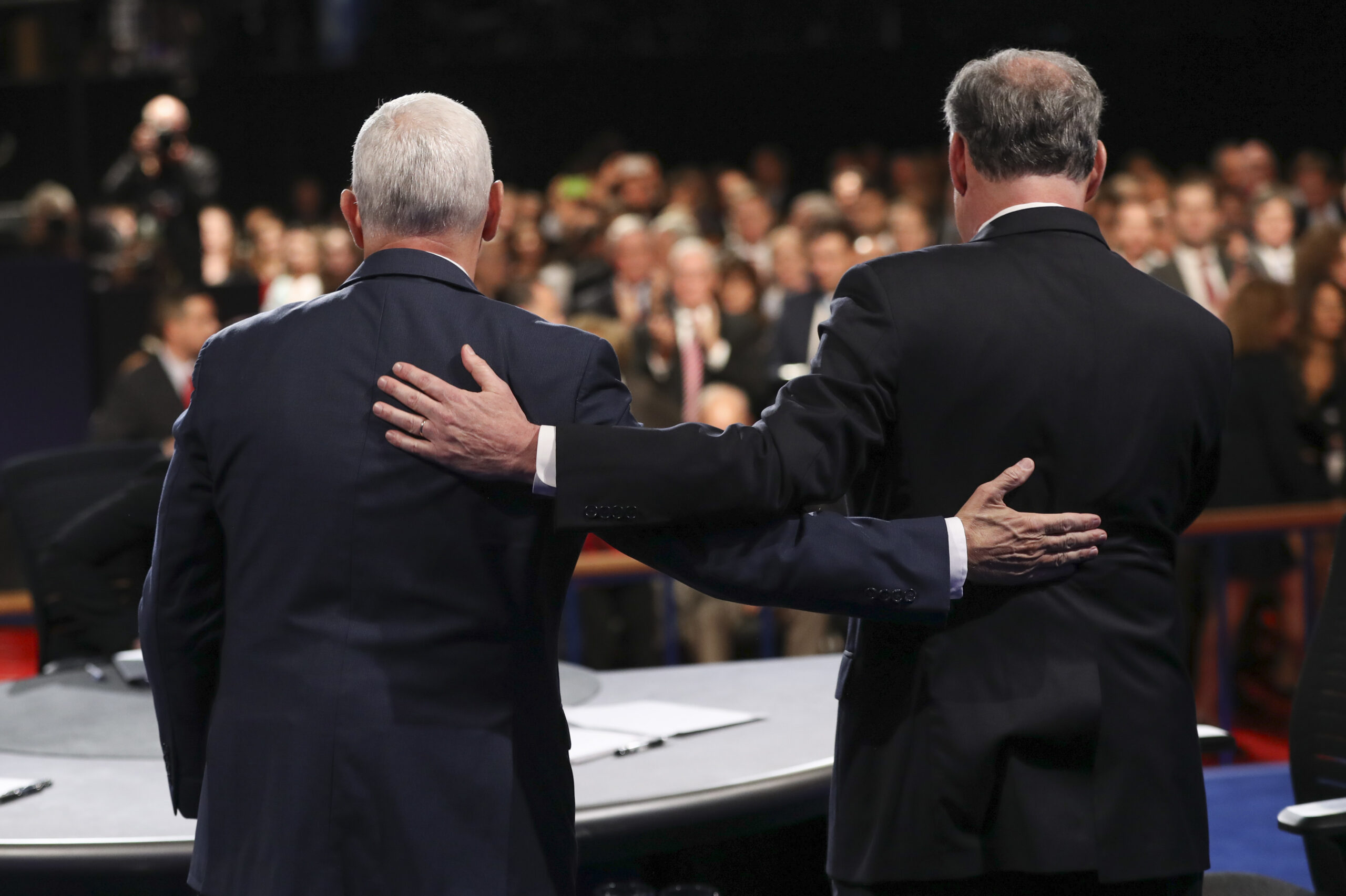 Republican vice-presidential nominee Gov. Mike Pence and Democratic vice-presidential nominee Sen. Tim Kaine stand after the vice-presidential debate at Longwood University in Farmville, Va., Tuesday, Oct. 4, 2016. (Joe Raedle/Pool via AP) (AP)