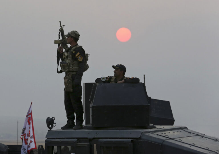 Iraq's elite counterterrorism forces advance toward Islamic State positions as fighting to retake the extremist-held city of Mosul enters its second week, in the village of Tob Zawa, outside Mosul, Monday, Oct. 24, 2016. A convoy of special forces advanced toward the village of Tob Zawa, Monday, encountering roadside bombs and trading heavy fire with the militants.(AP Photo/Khalid Mohammed) (AP)
