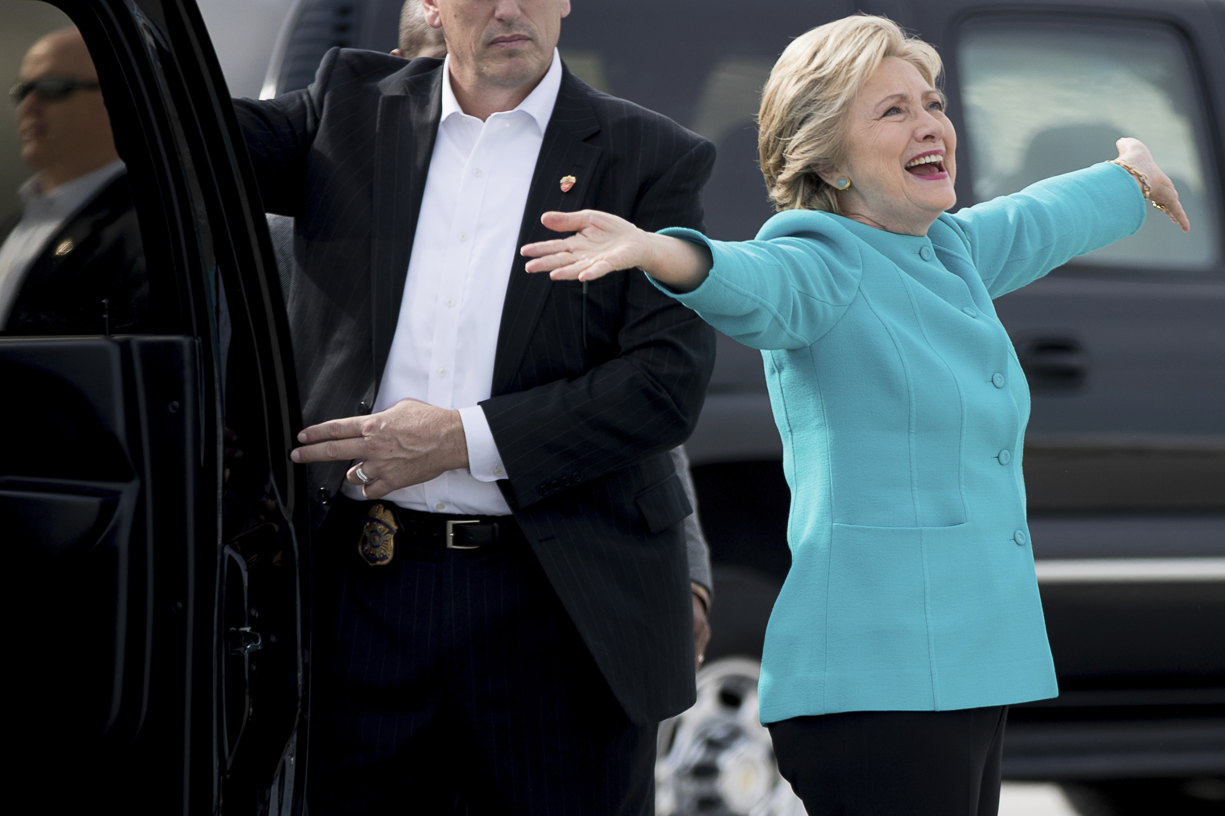 Democratic presidential candidate Hillary Clinton reacts to a reporters questions about her birthday before boarding her campaign plane at Miami International Airport in Miami, Wednesday, Oct. 26, 2016, to travel to Lake Worth, Fla. for a rally. Clinton turns 69 today. (AP Photo/Andrew Harnik) (AP Photo/Andrew Harnik)