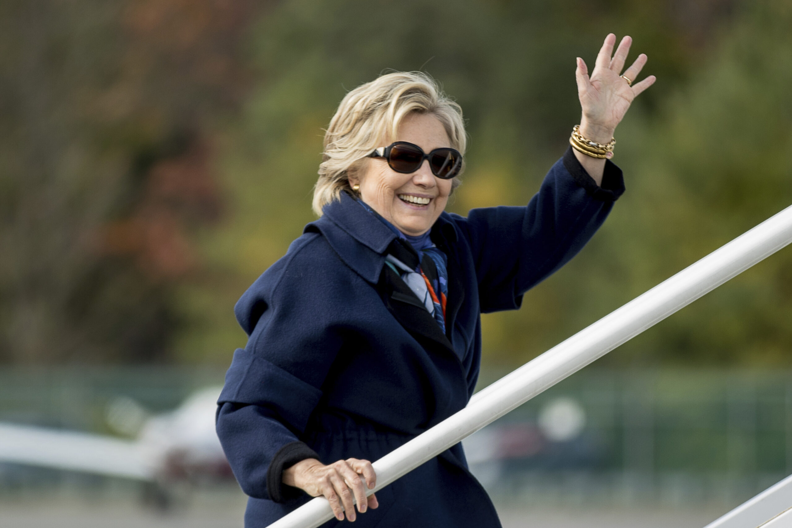 Democratic presidential candidate Hillary Clinton waves as she boards her campaign plane at Westchester County Airport in White Plains, N.Y., Saturday, Oct. 29, 2016, to travel to Florida. (AP)