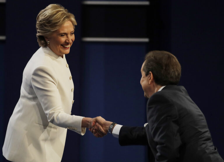 Democratic presidential nominee Hillary Clinton speaks shakes hands with moderator Chris Wallace following the third presidential debate with Republican presidential nominee Donald Trump at UNLV in Las Vegas, Wednesday, Oct. 19, 2016. (AP Photo/Patrick Semansky) (AP)