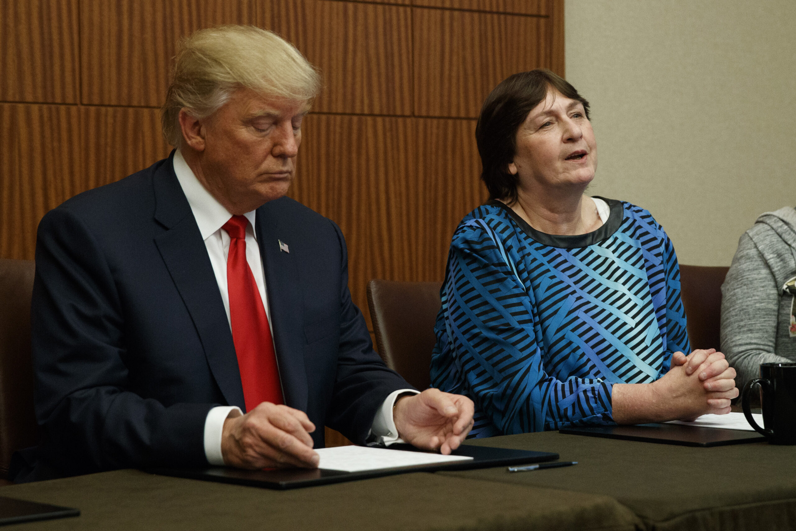 Republican presidential candidate Donald Trump, left, listens as Kathy Shelton makes remarks before the second presidential debate with democratic presidential candidate Hillary Clinton at Washington University, Sunday, Oct. 9, 2016, in St. Louis.  (AP Photo/ Evan Vucci) (AP)