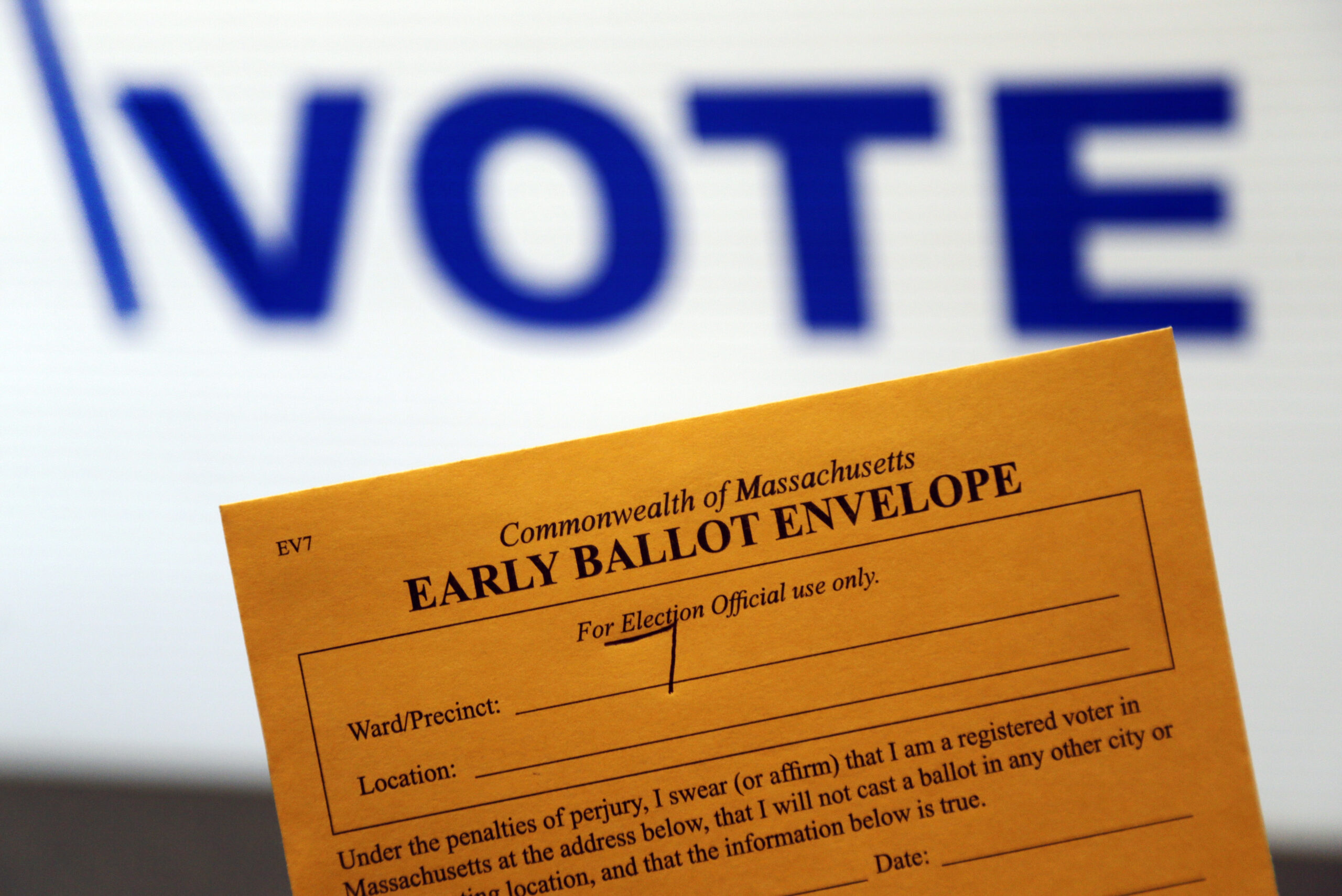 In this Oct. 24, 2016, photo, an early ballot envelope is held at town hall in North Andover, Mass. The millions of votes that have been cast already in the U.S. presidential election point to an advantage for Hillary Clinton in critical battleground states, as well as signs of strength in traditionally Republican territory. (AP Photo/Elise Amendola) (AP)